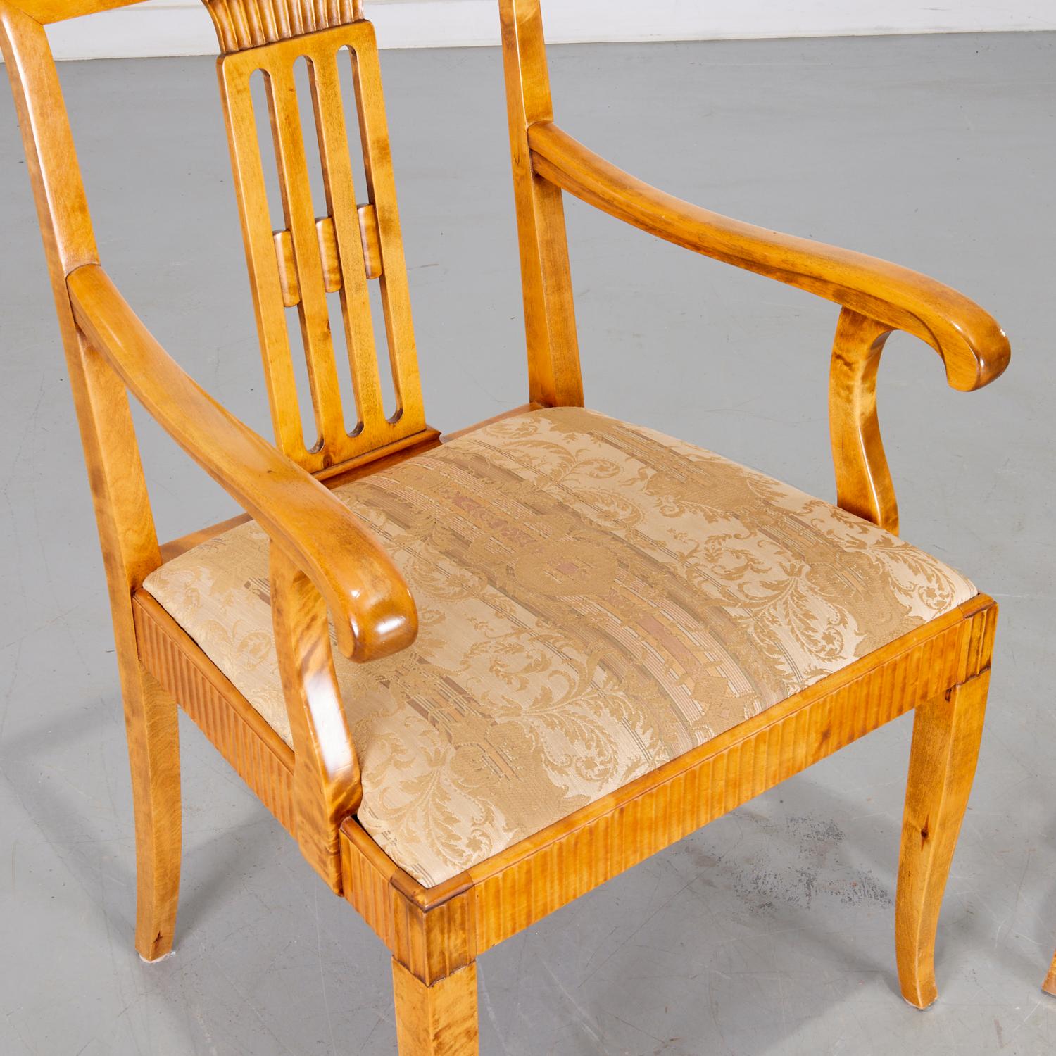 20th c., Swedish Neoclassical birch armchairs with pale damask upholstered seats, unmarked. These chairs are simply lovely. The sinuous lines of the arms and the crisp carved details on the back splat and around the seat result in a pleasing