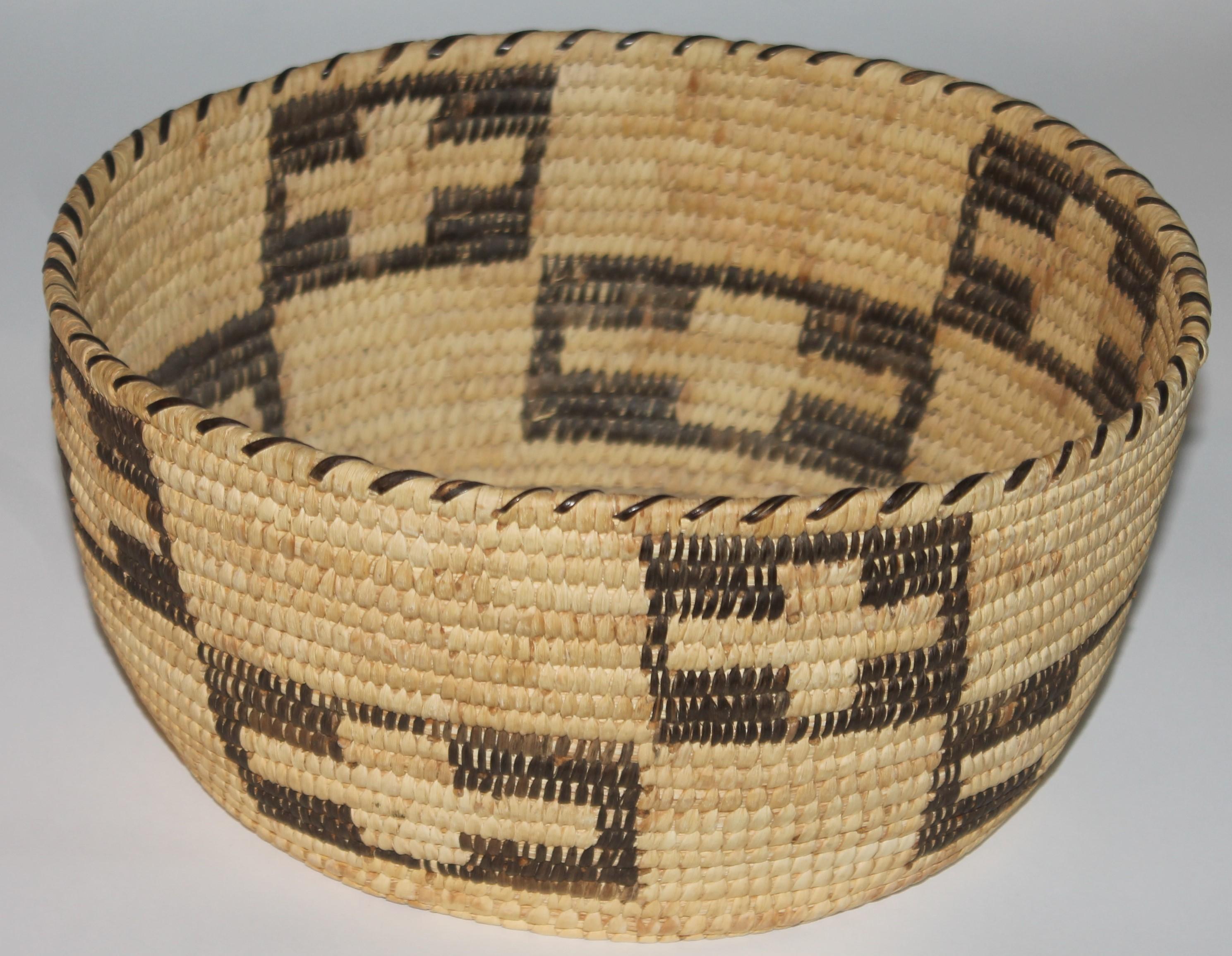 20th C Papago bowl shaped basket with geometric cross pattern.