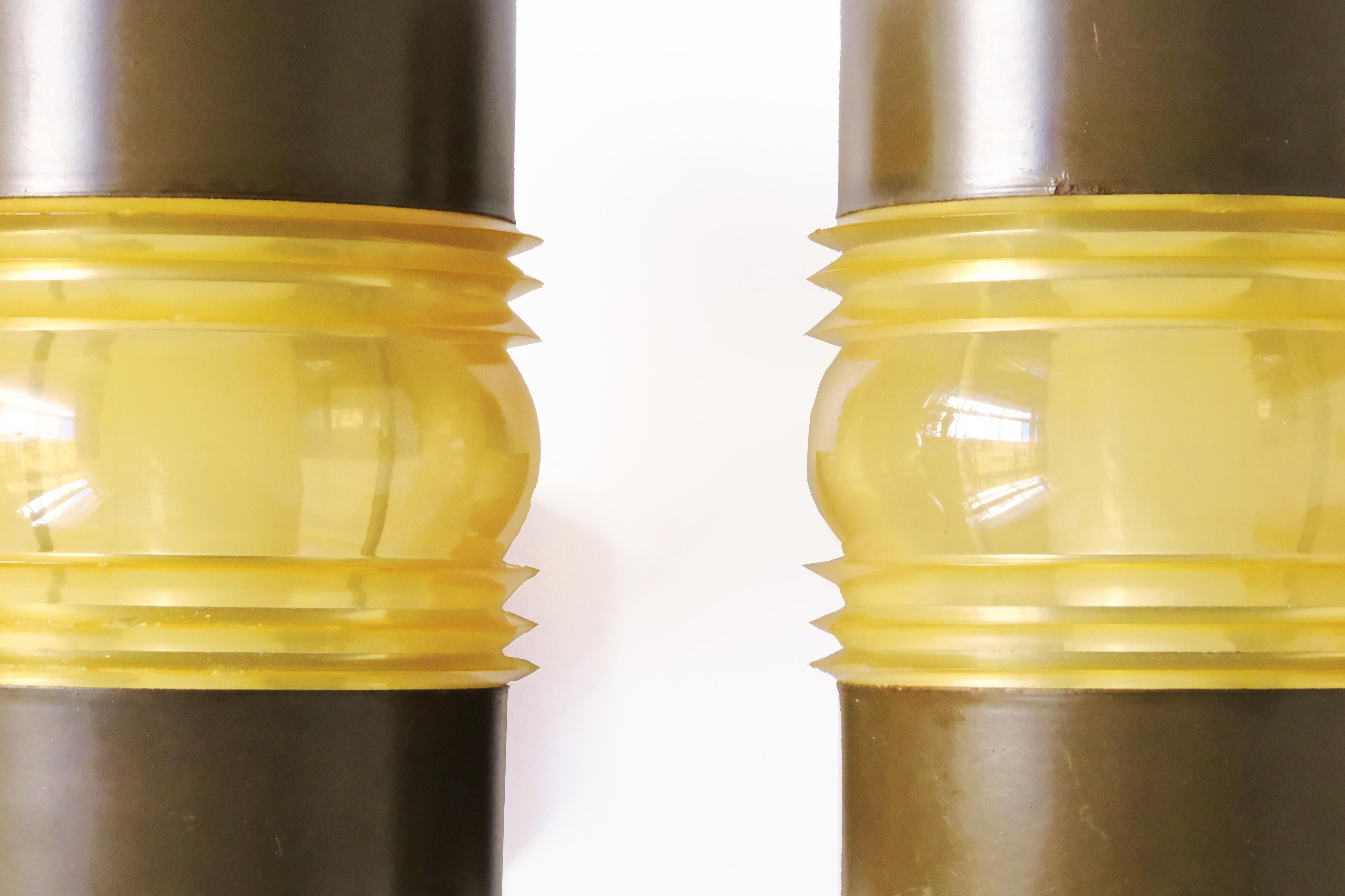 A rare find for collectors and design lovers these authentic, functional, and full of character pair of outdoor wall sconces by renowned Dutch design house RAAK Amsterdam bring a mid-century industrial charm to any space. Signature is found on the