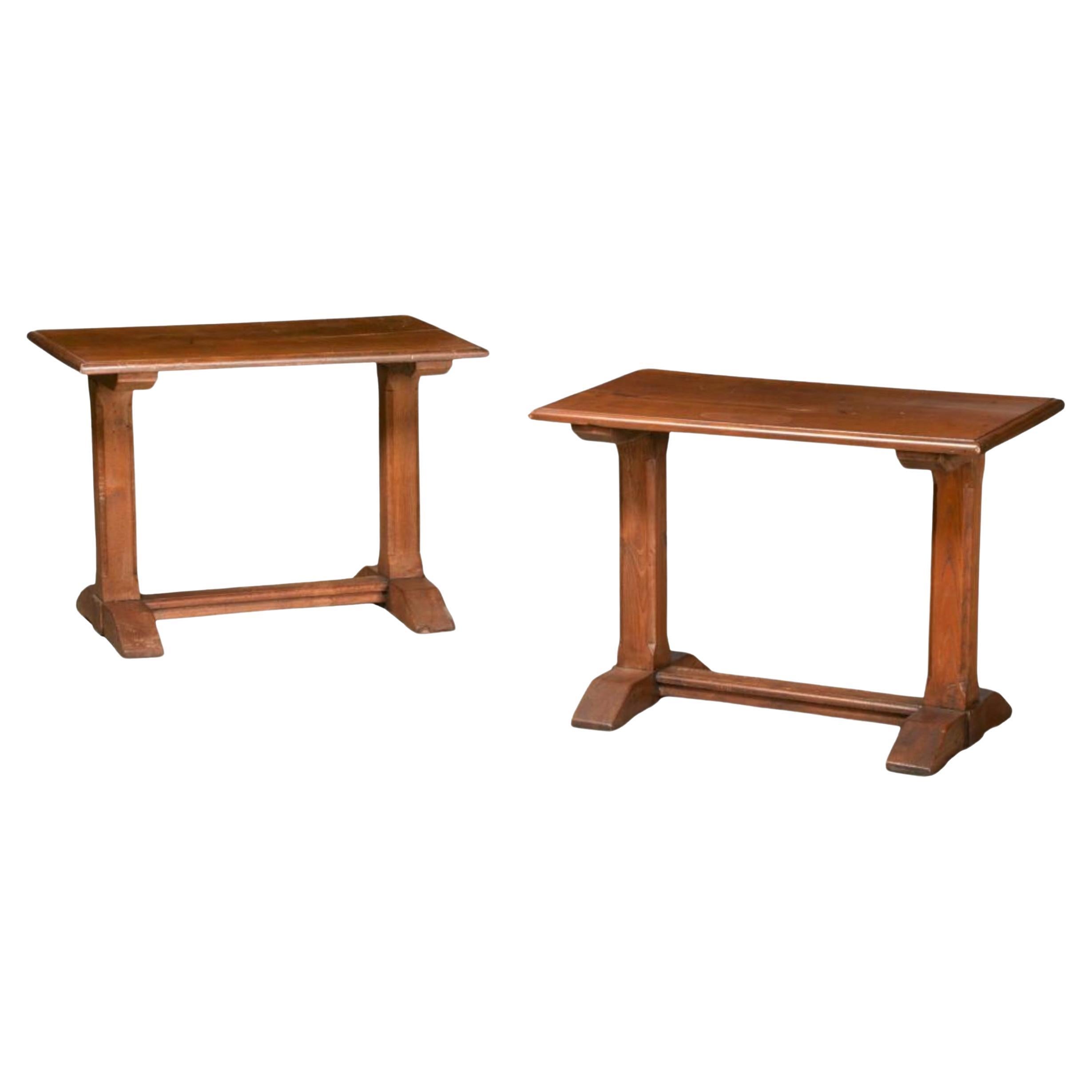 Perfect for the family room! This is a pair of rustic French carved walnut side tables attributed to Grange. Their simplicity makes them very versatile. They are in very good condition.