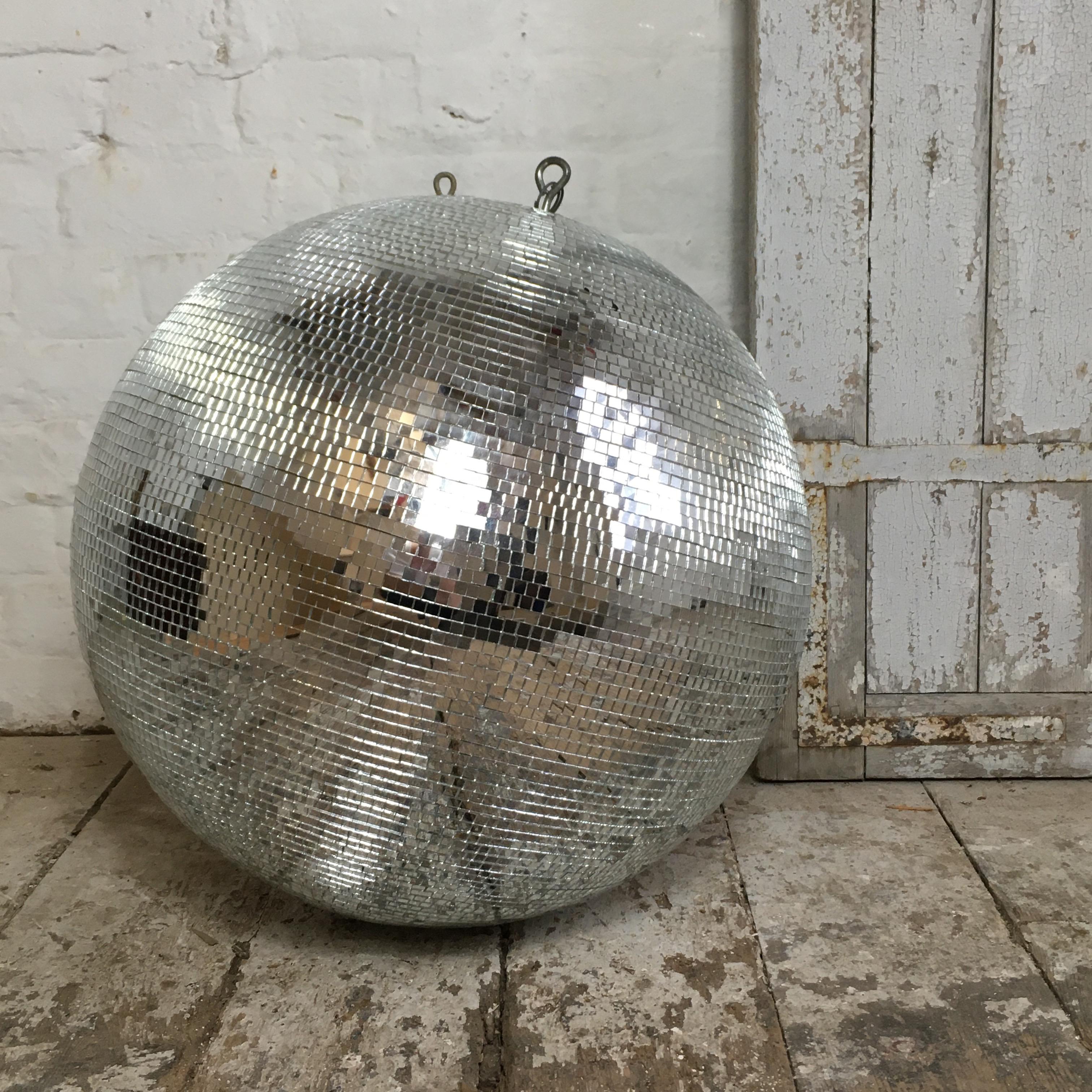 Large size vintage mirror ball, circa 1970s-1980s. 50cm diameter, 100cm circumference. Heavy duty chain approx 70cm length included. Small sized mirror squares, 7mm. The mirror ball has its motor and chain and is full working spinning order, motor
