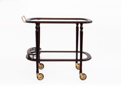 20. Jh. Zweistöckiger Servierwagen aus lackiertem Holz und Glas mit Messingdetails, 1940