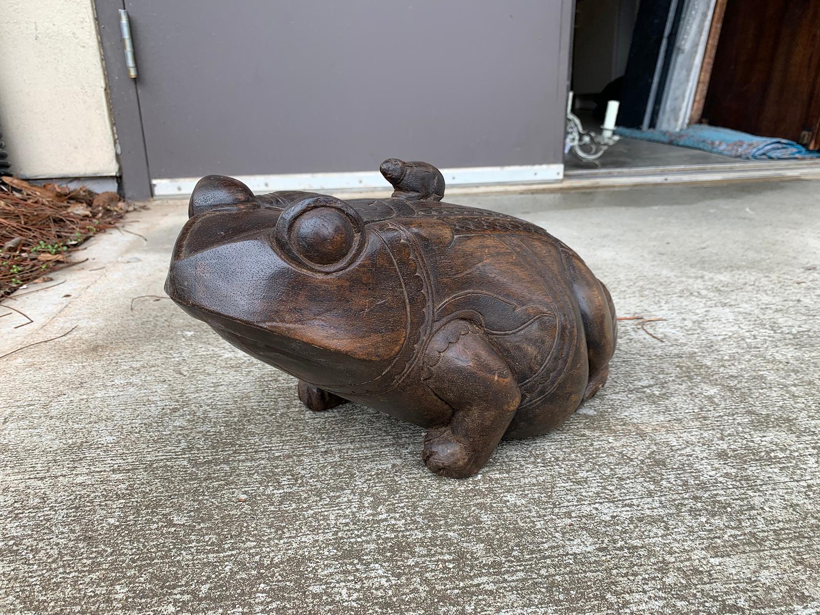 carved wooden frog