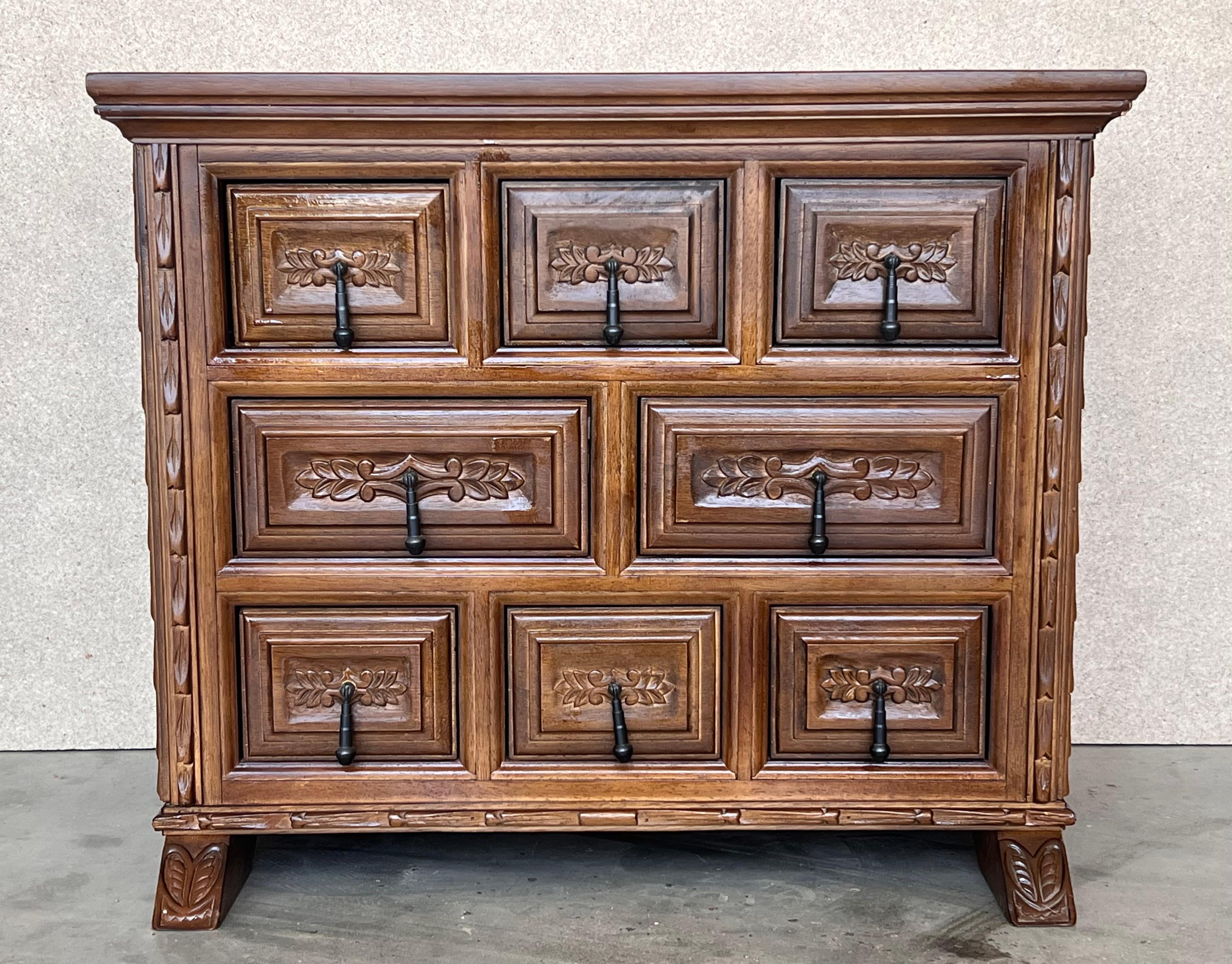 From Northern Spain, constructed of solid walnut, the rectangular top with molded edge atop a conforming case housing eight drawers paneled with solid walnut, raised on two plint legs.
Carved on the molding sides , drawers and legs of the front and