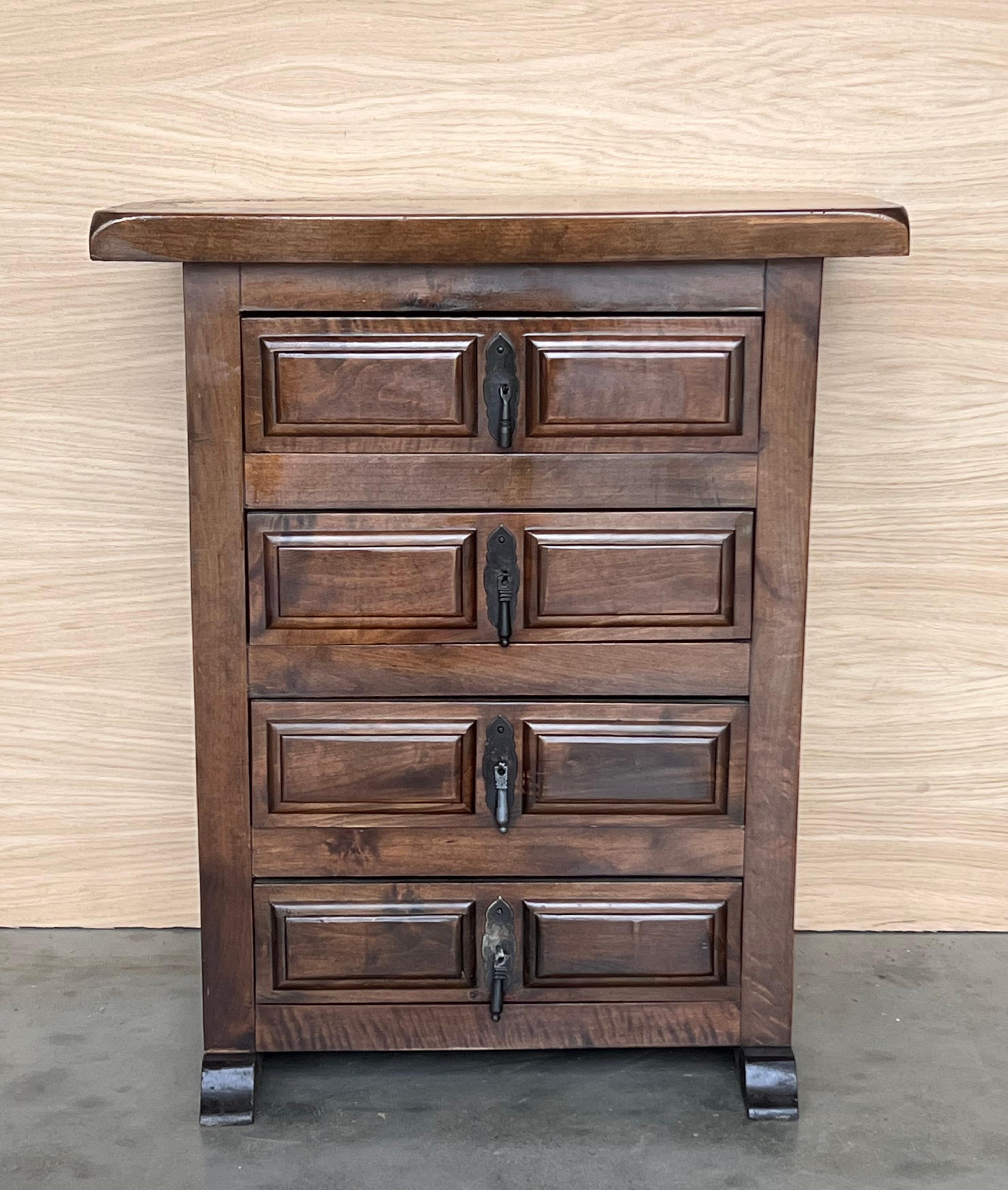 From Northern Spain, constructed of solid walnut, the rectangular top with molded edge atop a conforming case housing four drawers paneled with solid walnut, raised on two plint legs.
Carved on the molding sides , drawers and legs of the front and