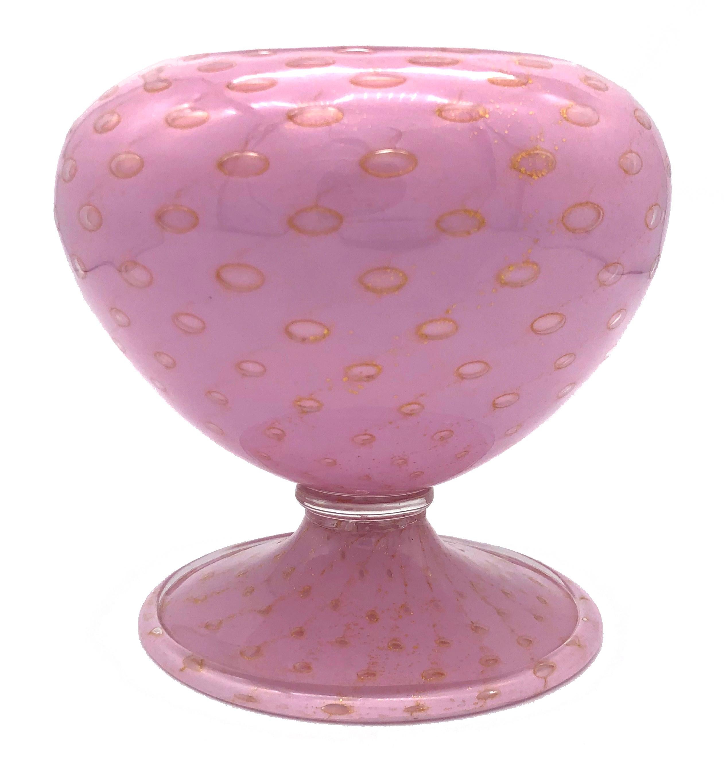 Wonderful rich pink art glass vase by Salviati & Co, Italy with the original gold colored paper label, 20th century. The elegant design is enhanced by golden bubbles decreasing in size from top to bottom.