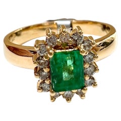 20th Century 0.50 carat Emerald  0.26 carat Diamond Cluster Ring