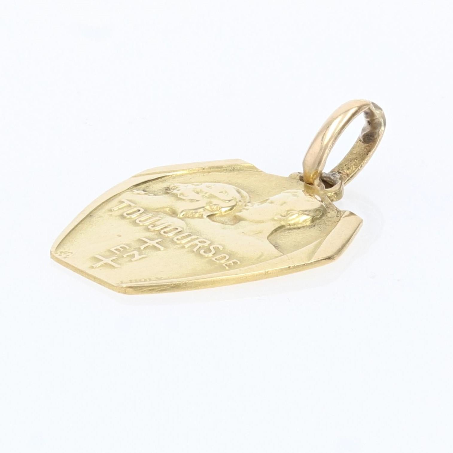 Médaille en or jaune 18 carats, poinçon tête d'aigle.
Cette médaille représente une femme épaulée par un homme et porte l'inscription 