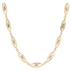 Collier en or jaune 18 carats du 20e siècle avec chaîne de montre à filigranes