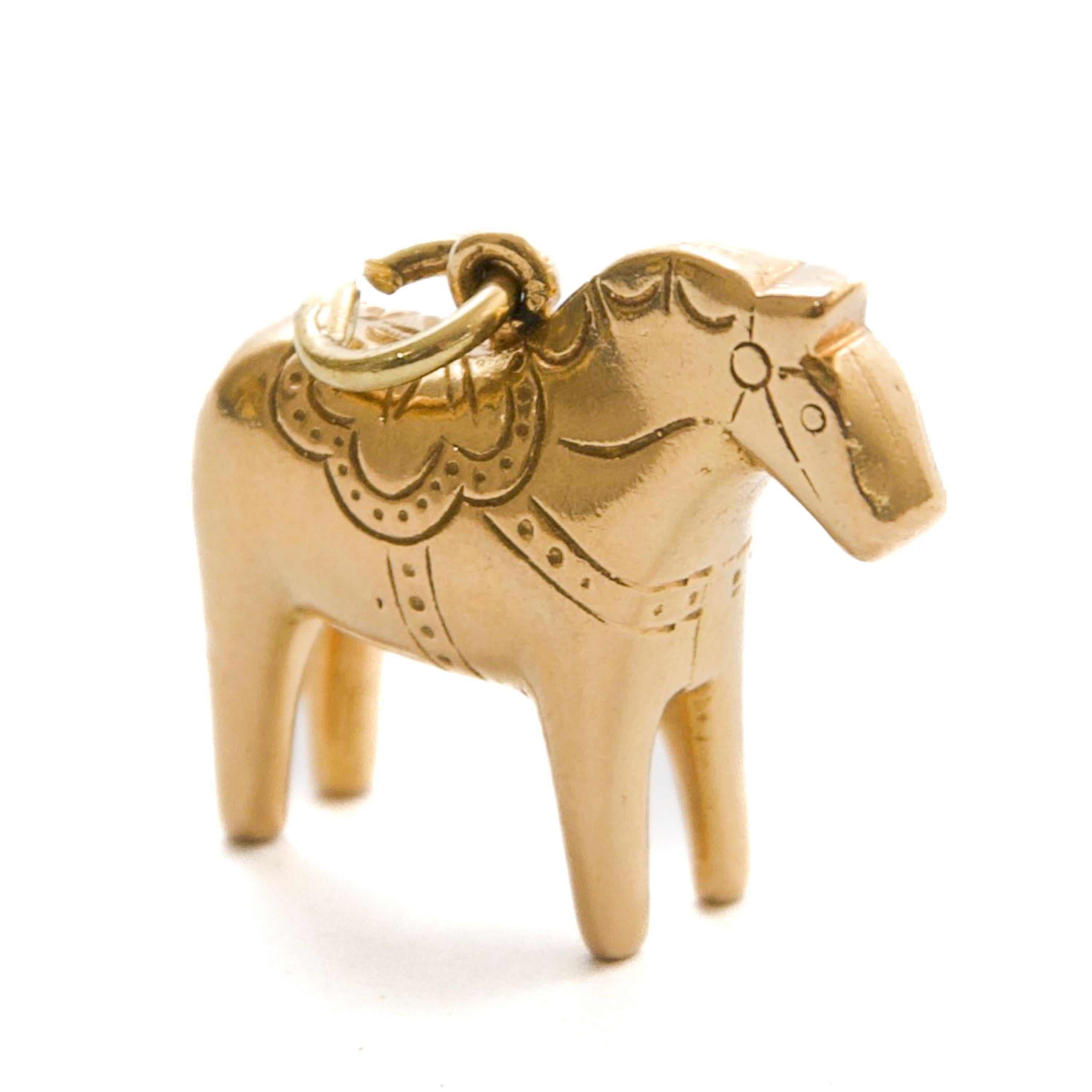 This charming solid 18 karat gold pendant is modeled after the traditional Swedish Dala horse, a beloved symbol of Scandinavian heritage. It captures the graceful simplicity and folk artistry associated with this centuries-old motif.

The Dala horse
