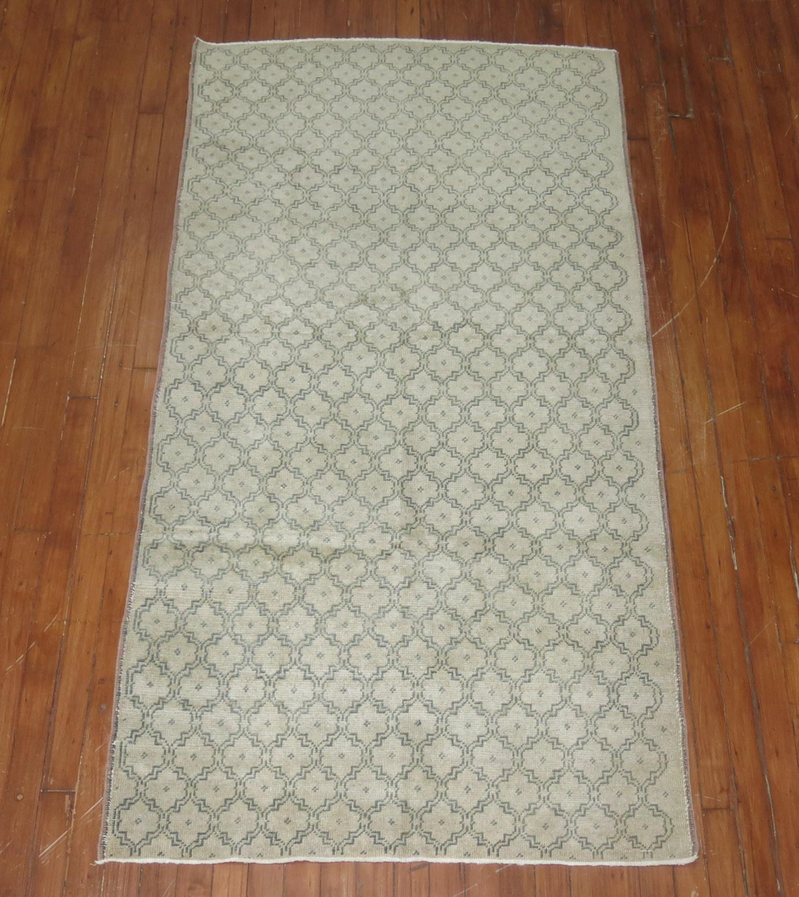 Short mid-20th century Turkish Konya runner. Accents in beige and green with a repetitive design.

Measures: 3'3” x 6'6”.