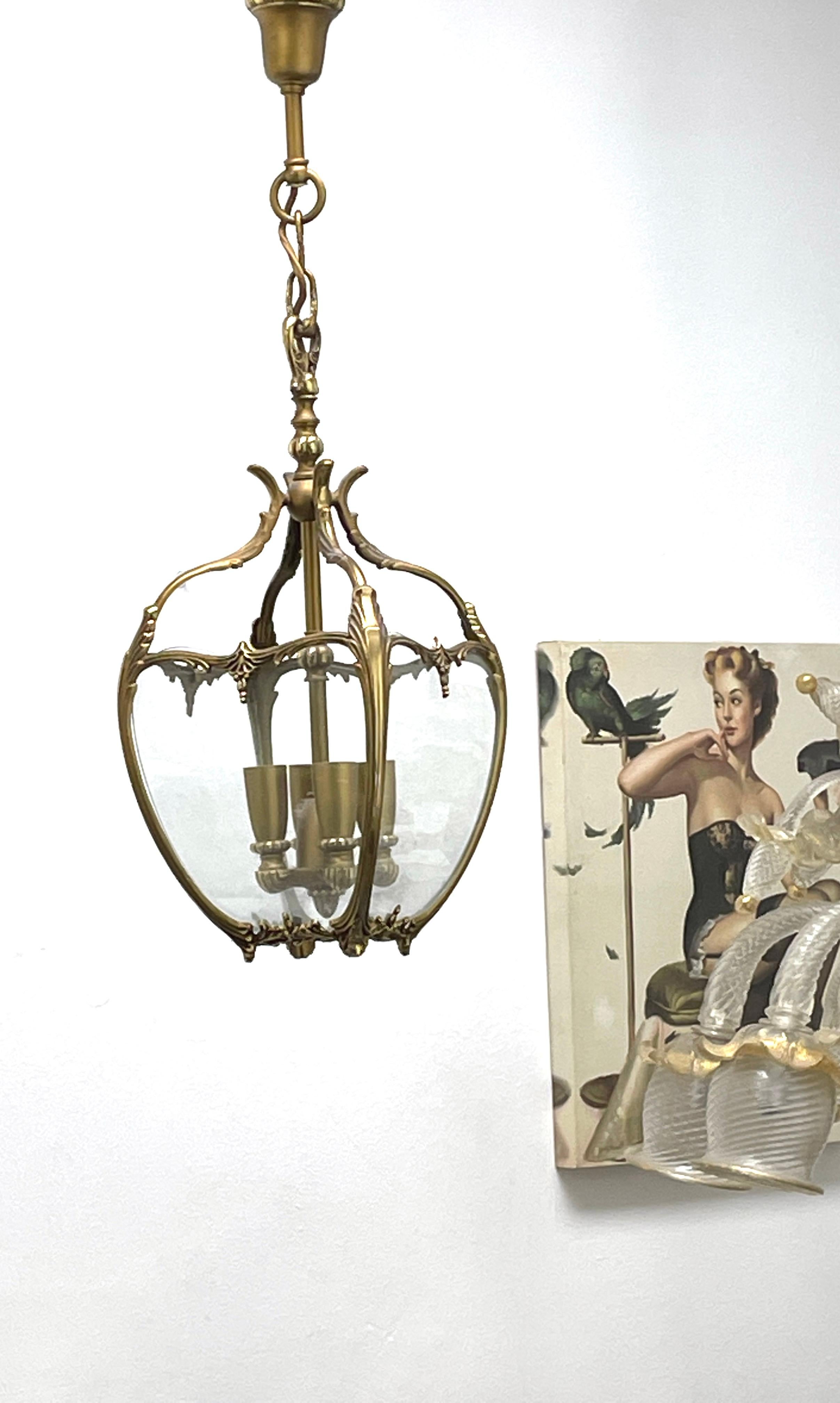 Add a touch of opulence to your home with this charming lantern pendant light. Perfect metal and glass to enhance any chic or eclectic home. We'd love to see it hanging in an entryway as a charming welcome home. Built in the 1960s, in Germany, this