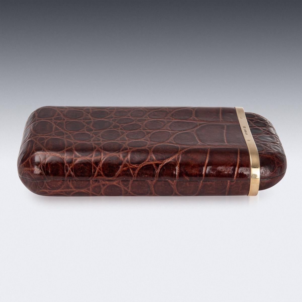 Stylish mid-20th century British made 9k gold mounted on sumptuous crocodile leather cigar case, of rounded rectangular form, with a pull off lid and interior that is sufficient for five mid-size cigars. Hallmarked with English gold marks 9 (375