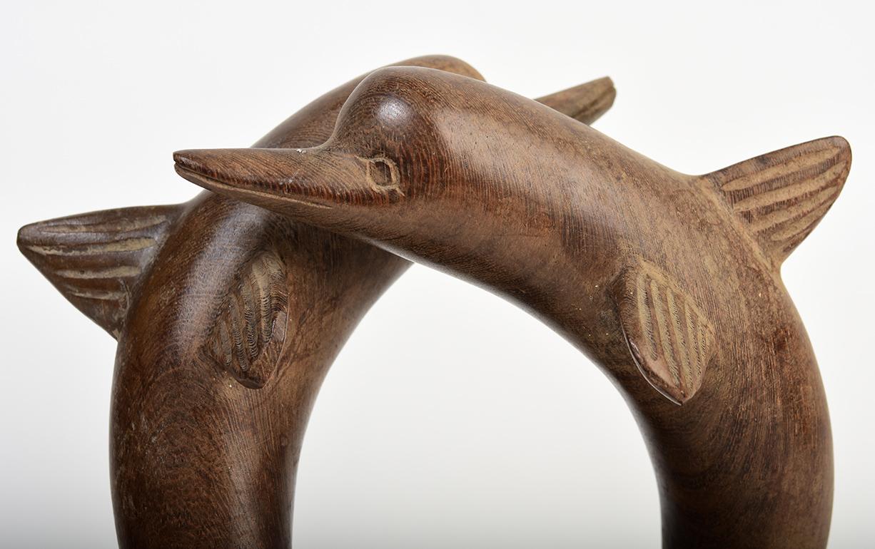 A pair of Burmese wooden dolphins.

Age: Burma, 20th century
Size: Height 21.5 C.M., Width 9 C.M., Length 17.3 C.M.
Condition: Nice condition overall.

100% satisfaction and authenticity guaranteed with free 