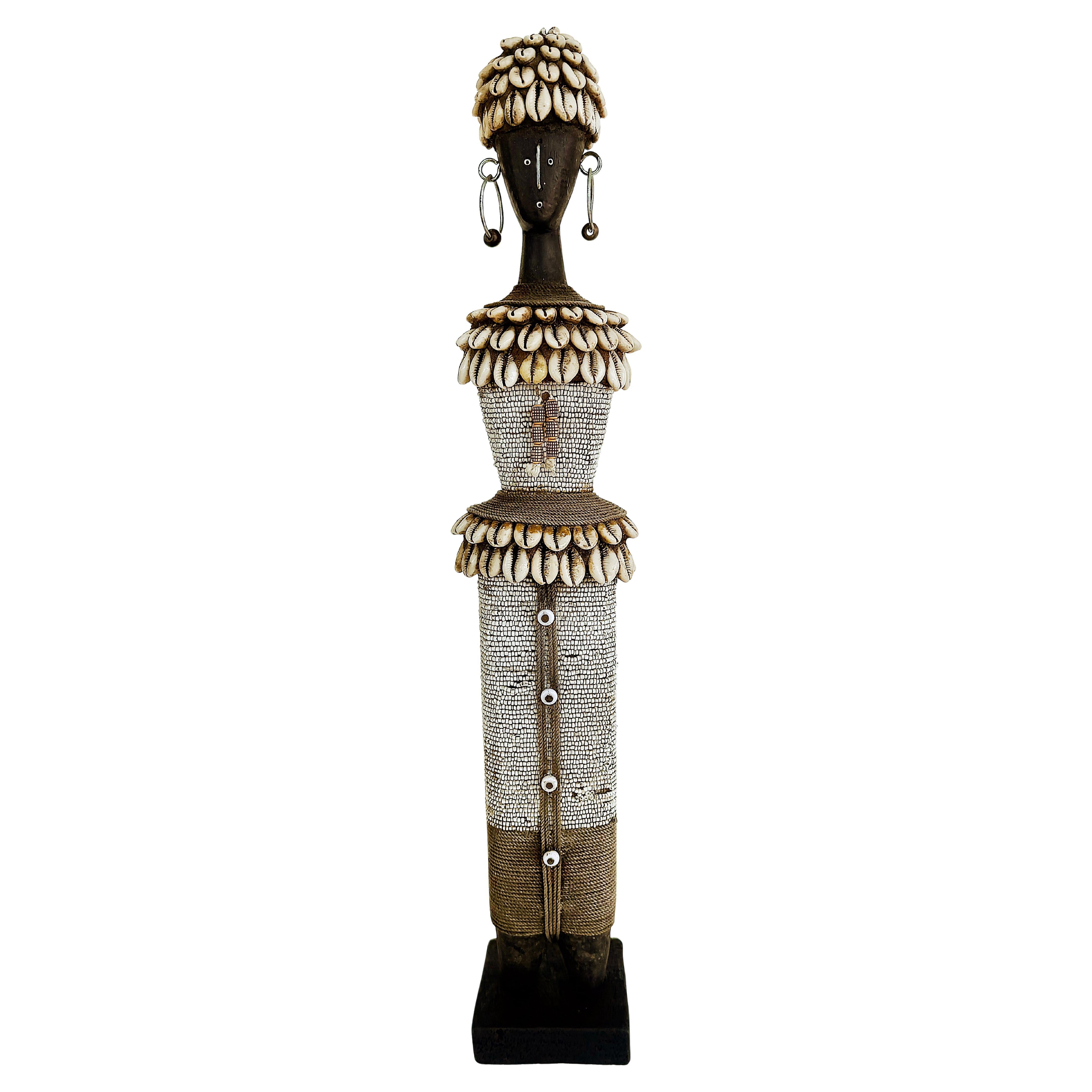 What are carved wood figures in African art?