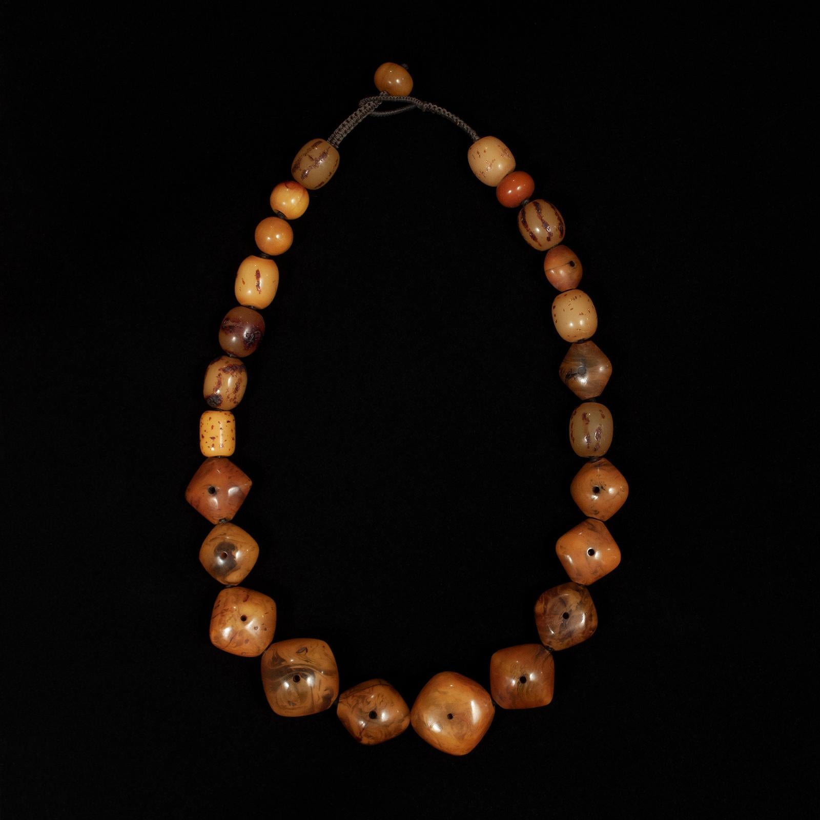 “African amber” (phenolic resin) necklace by unknown designer

This striking necklace is made with smooth old African 