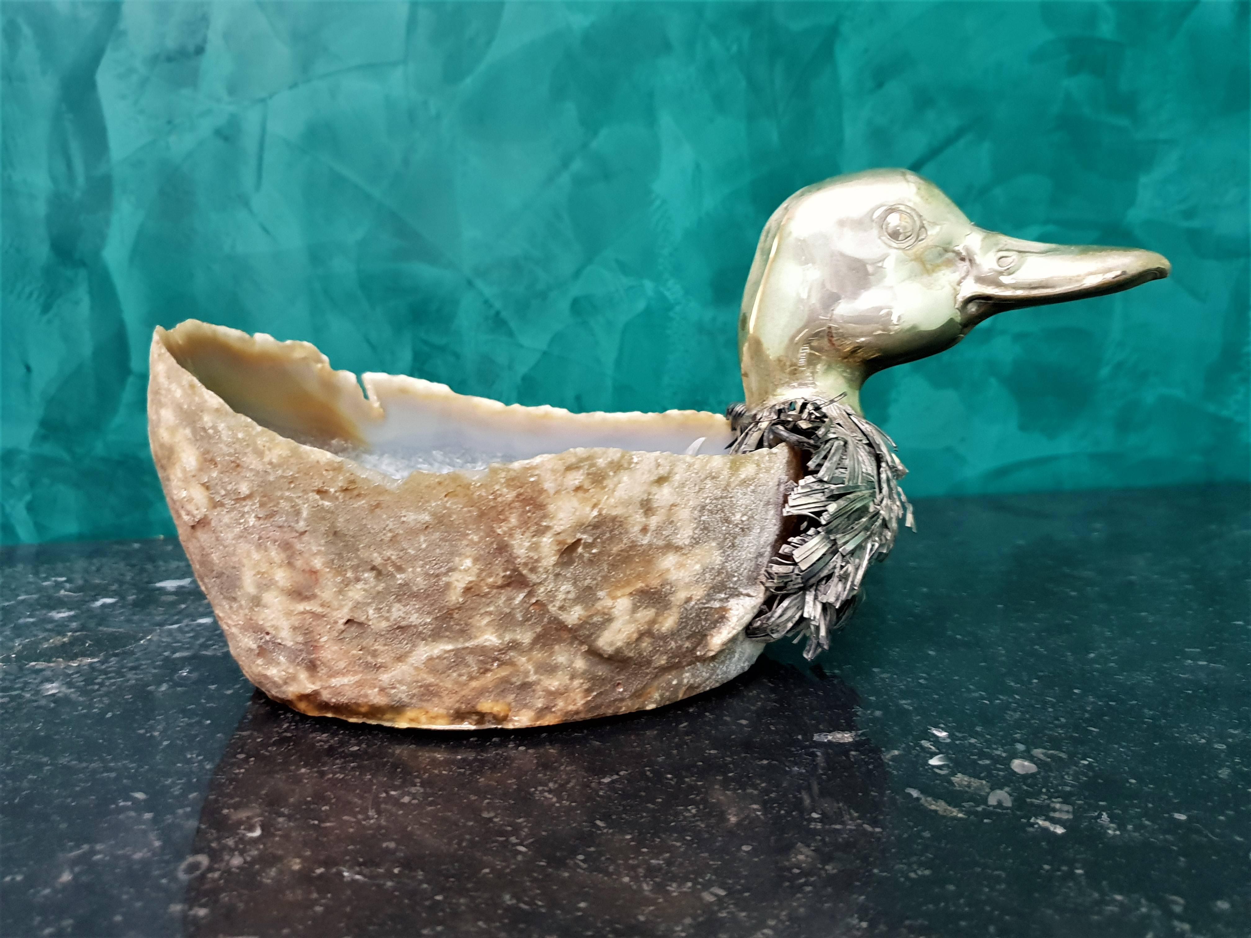 Alabaster and silver duck, Italy, circa 1950s.
The head of the duck is in gilded silver and the body is made by a very beautiful piece of polished alabaster.
Measures: Width 27 cm, height 13.5 cm.
