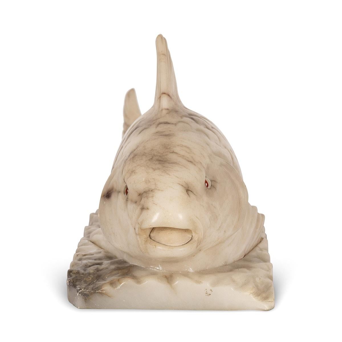 Mid 20th Century Fabulous fish table lamp, hand carved from two solid pieces of alabaster. When switched on the light emits a delicate glow and eyes radiate red.

CONDITION
In Great Condition - wear concistent with age.

SIZE
Height:
