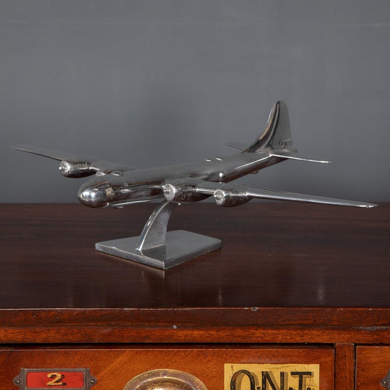 A Stunning 20th Century model of an American 1940's Boeing B-29 Superfortress bomber, made of polished aluminium, standing on an elegant stand. This item makes for a fantastic conversation piece, suitable for any interior, both modern or