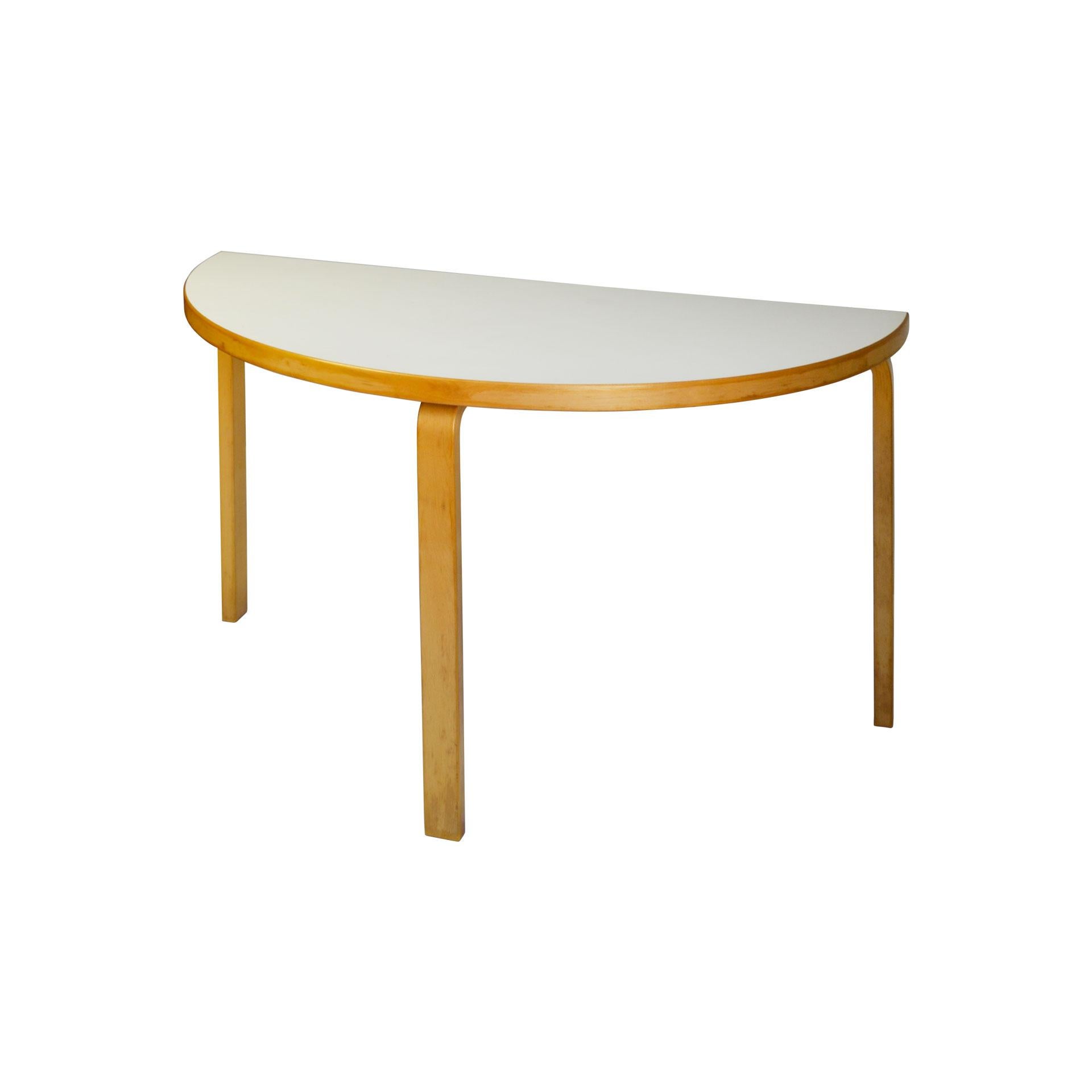 Consolle, table designed by the great finish architect and designer Alvar Aalto in the middle of 1930s. Whether used for dining, working, or playing, the table retains its character while offering endless possibilities. The half-round table can be