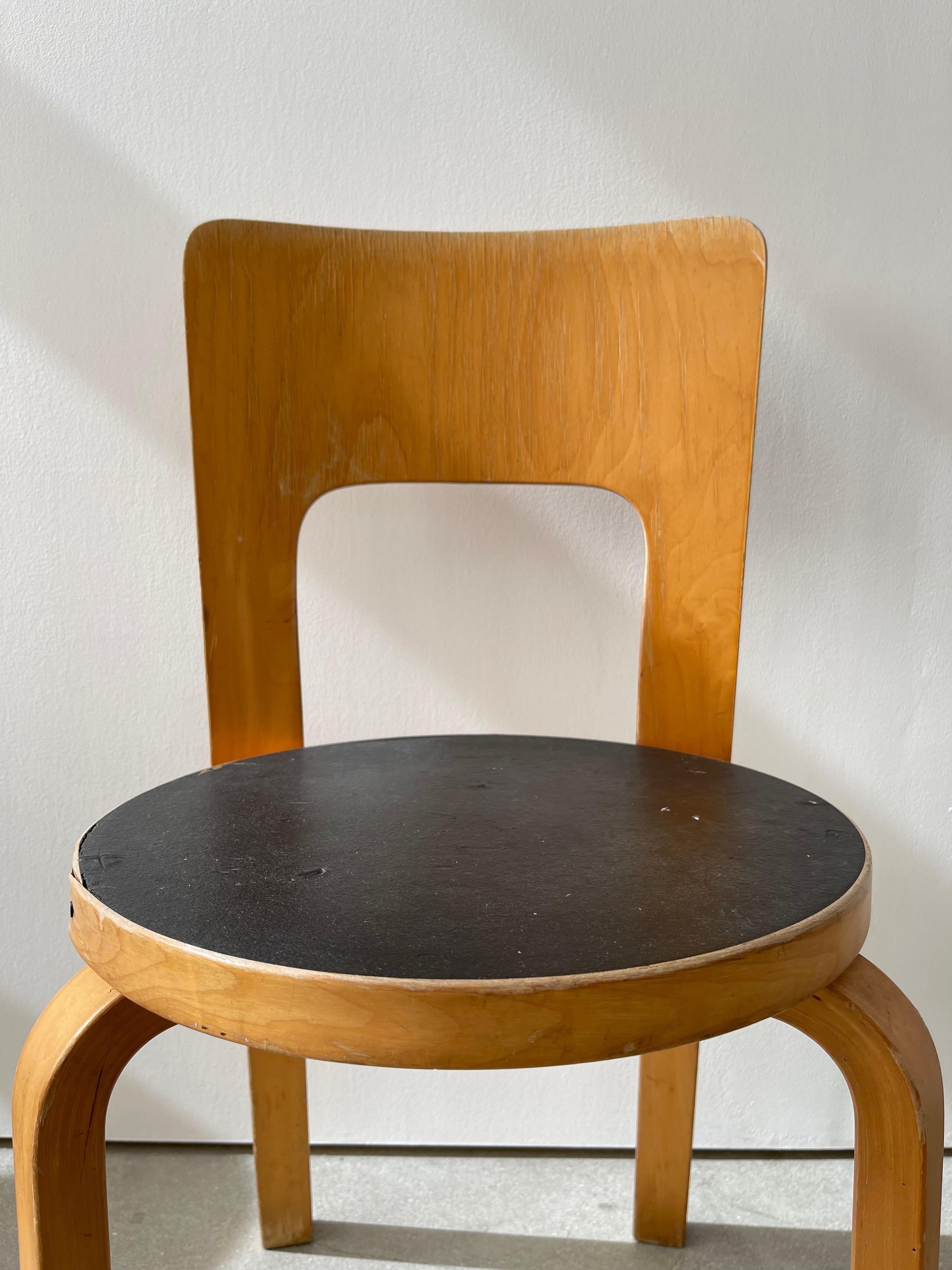 20th century Alvar Aalto Model 66 chair with the high-back dining chair has a solid birch core with birch laminate and face material. Solid birch legs and a high seat back made from molded birch plywood give the chair a formal presence. The 66 chair