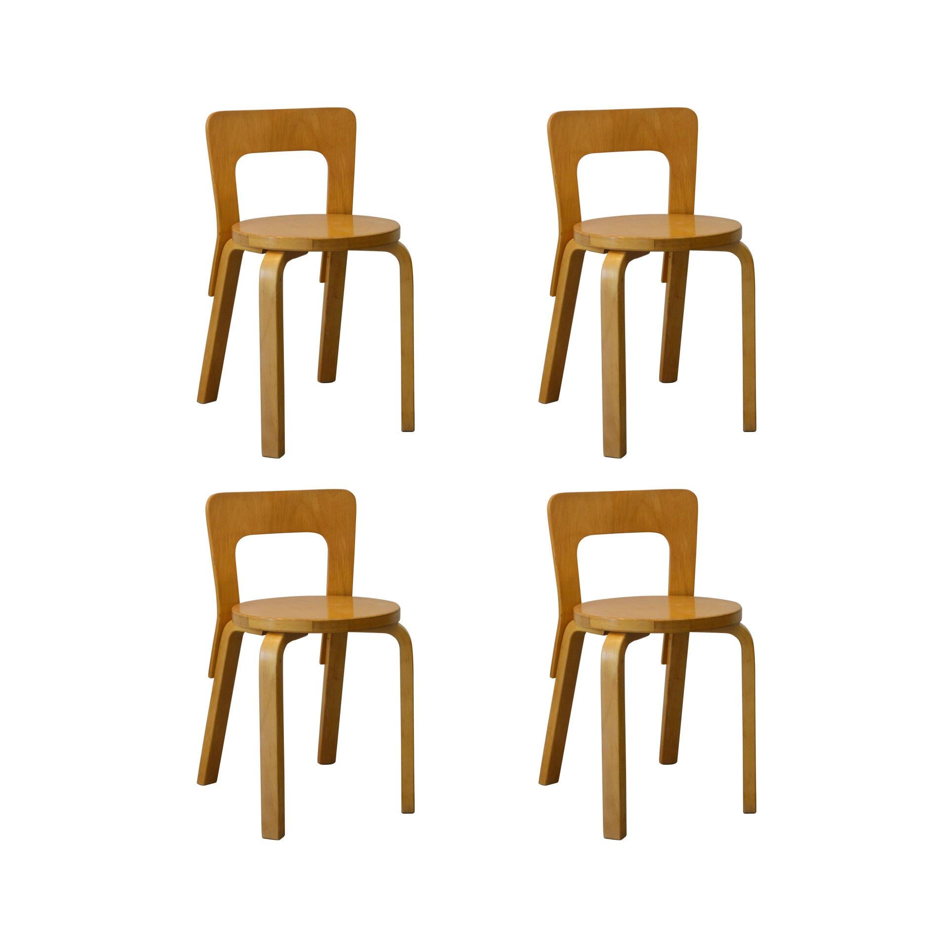 Set of four chairs model 65 designed by Alvar Aalto for Artek in 1960s. Good condition, original in all parts, patina of time.