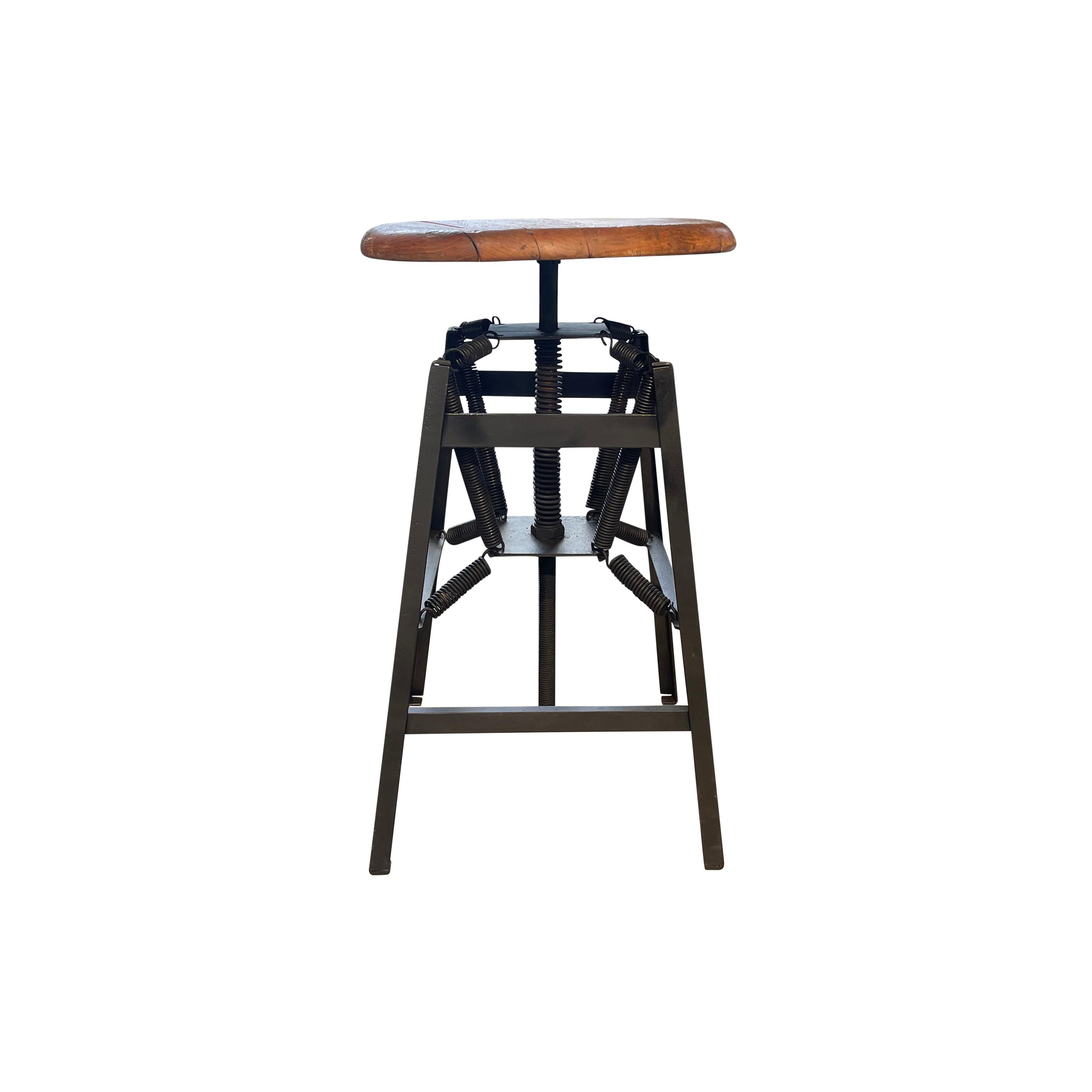 An antique Industrial American stool made of hand crafted steel designed by Charles E. Miller and fabricated by the American Cabinet Co. located in Wisconsin, in good condition. This single side seat chair is a medical 
