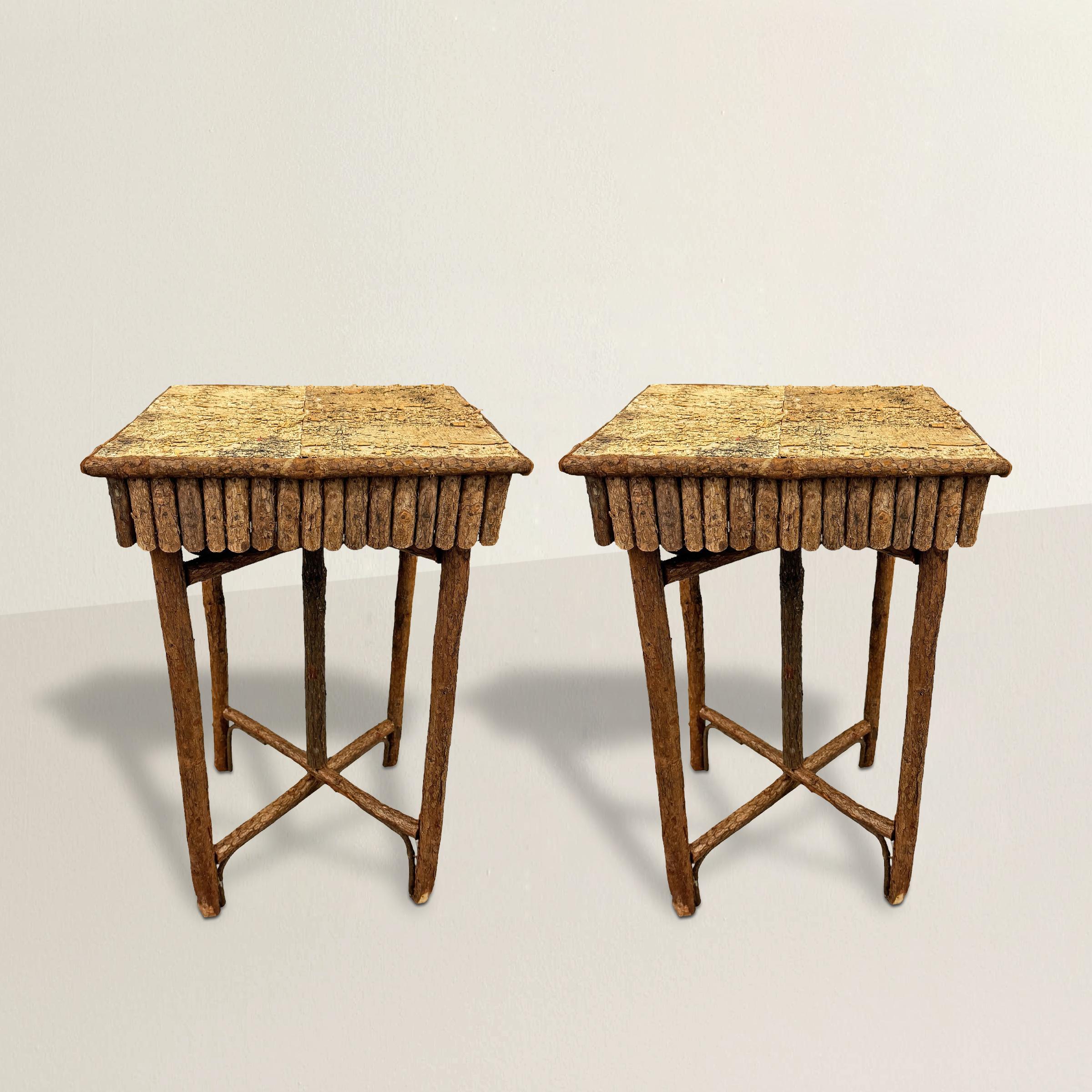 These charming 20th century American Adirondack style side tables embody the rustic allure of the Adirondack region, with aprons and legs crafted from hickory branches. Their tops, adorned with the timeless beauty of birch bark, evoke a sense of