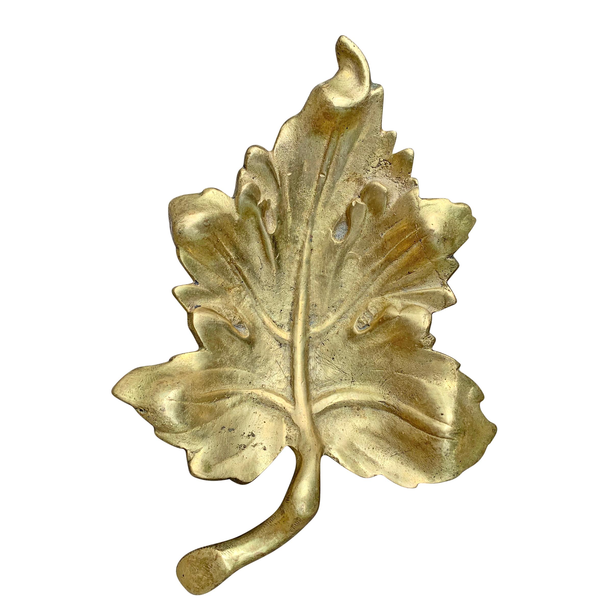 A super cool 20th century American cast bronze leaf dish with a worn finish and a beautiful patina. Perfect for change, keys, or other vices!