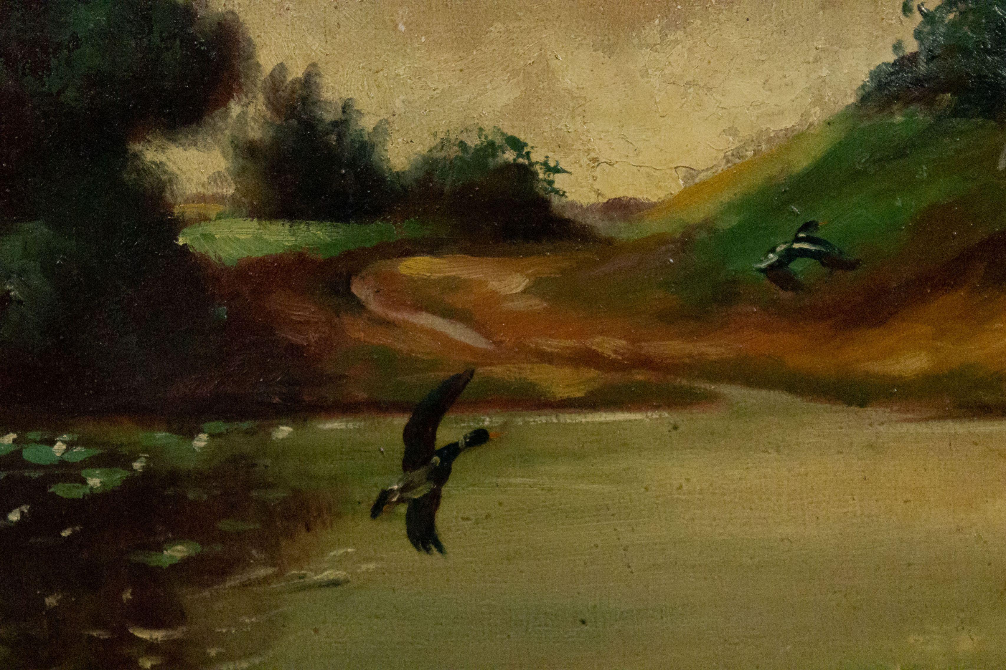 American Country style (19/20th Cent) maple framed oil painting with 2 ducks flying over a pond with a large tree in foreground vertical landscape.
 