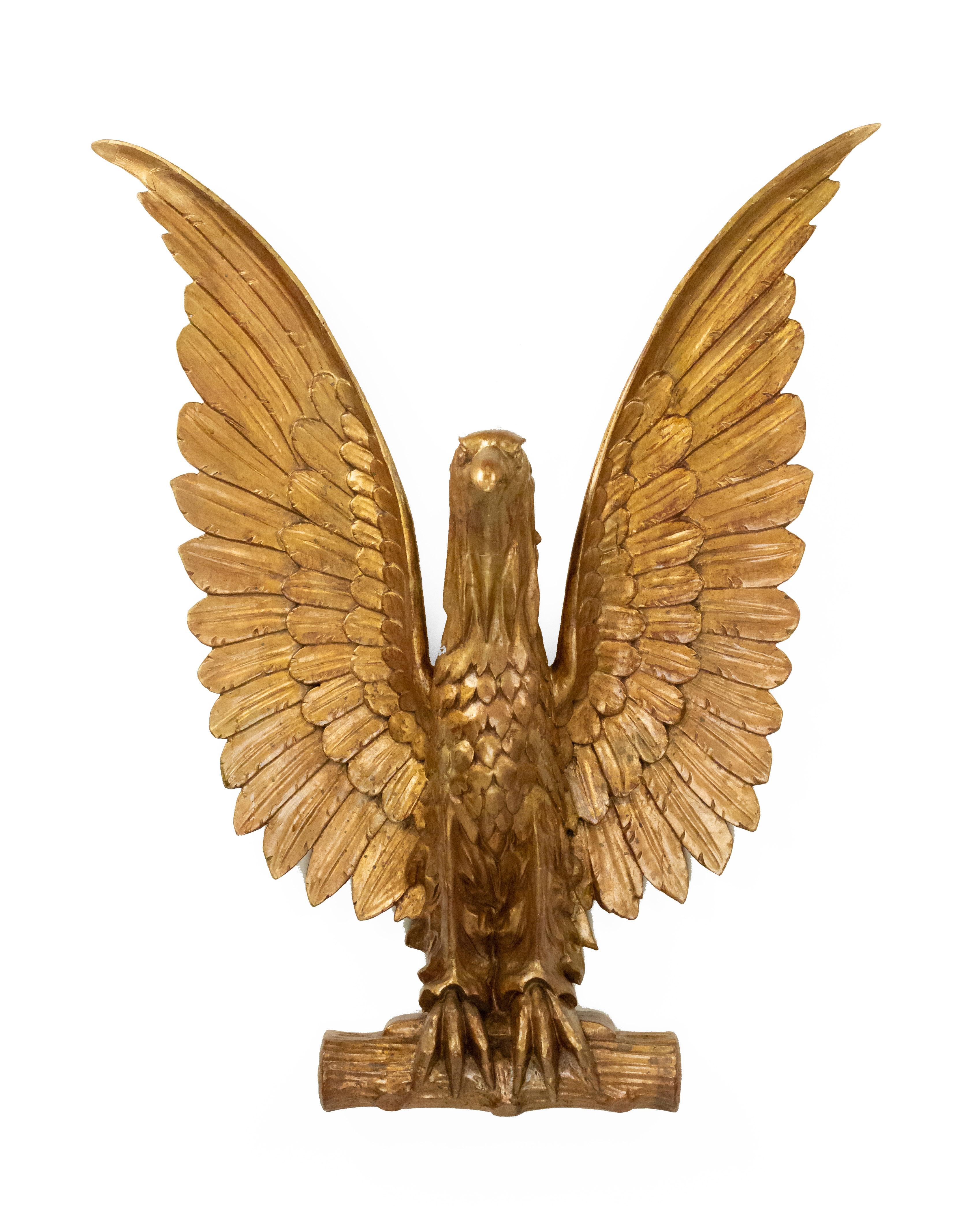 20th-Century American gilt carved eagle wall plaque with wings spread upward.