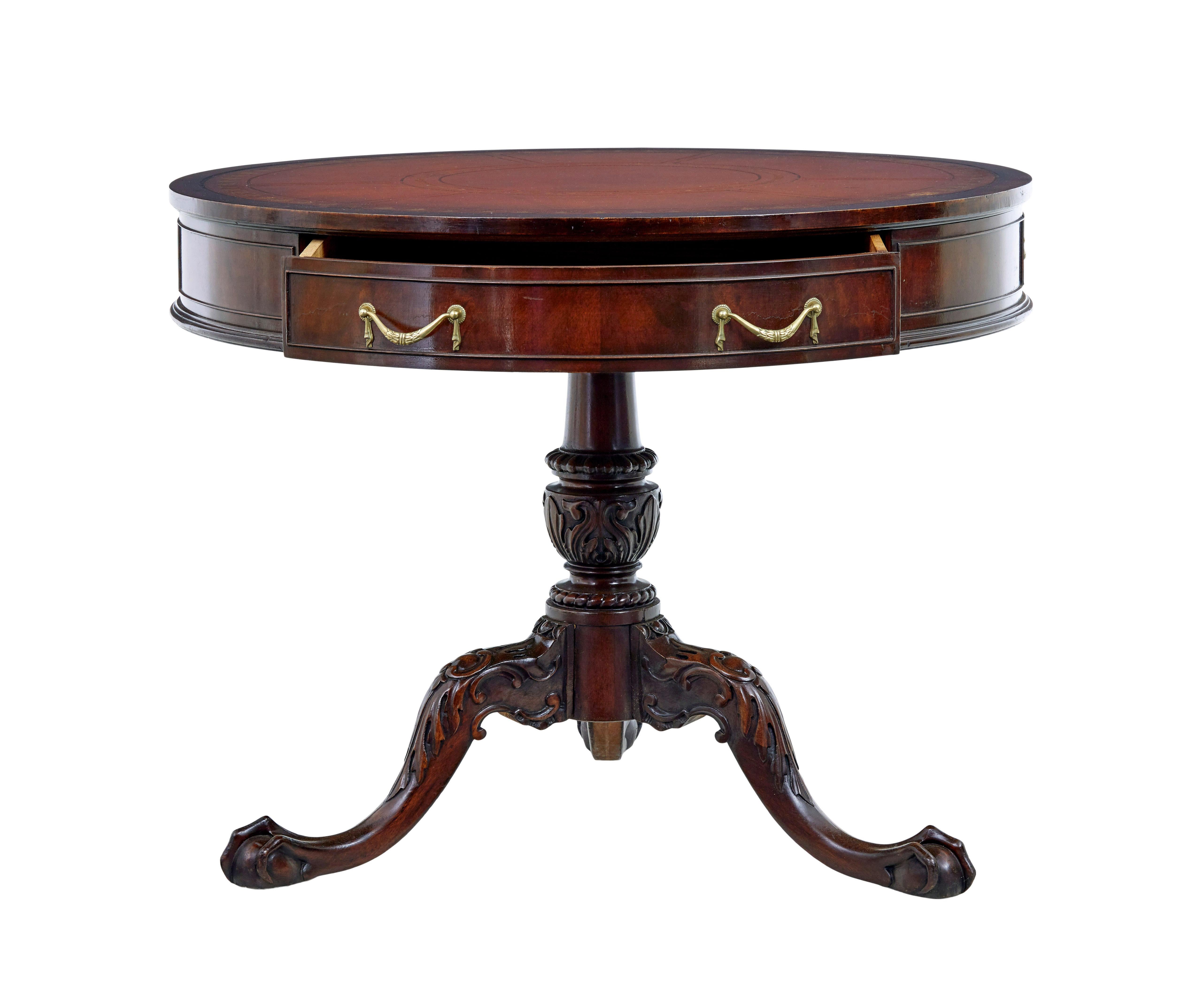 1960's mahogany drum table by imperial Grand Rapids Michigan.

Good quality table often known as a drum table.

Circular red leather top decorated with gold and black tooling.  1 single drawer and a further 2 dummy drawers.  Standing on a heavily