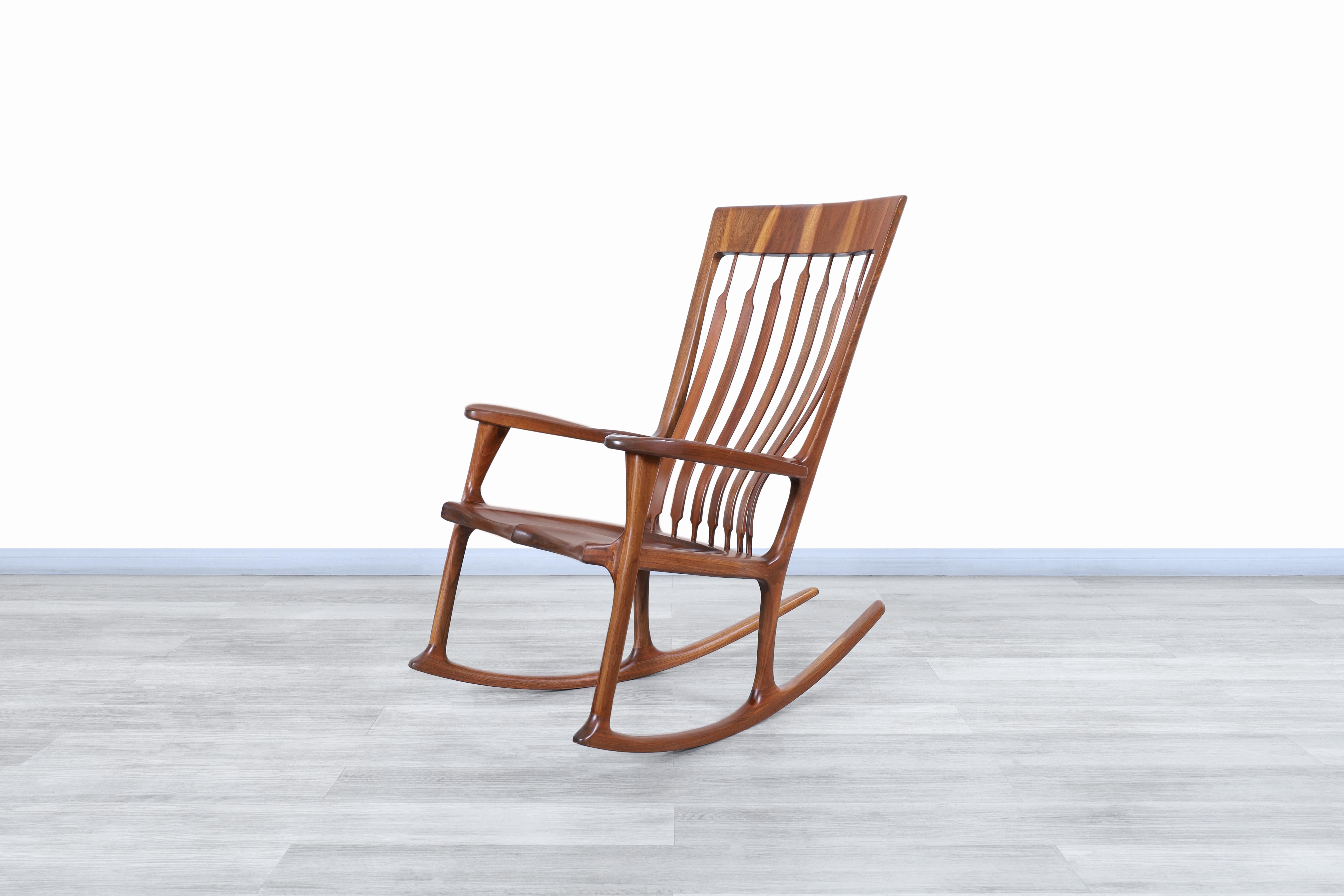 Beautiful vintage 20th century American studio Craft walnut rocking chair designed in the United States. This rocking chair has a design inspired by the most representative models of Sam Maloof, where attention to detail was made to imitate both his