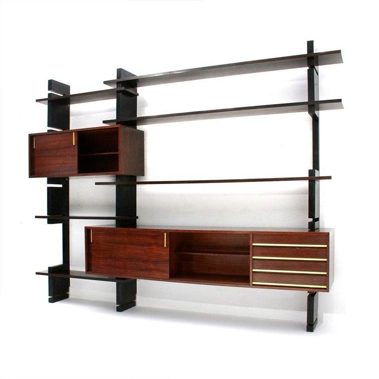 20th Century AMMA Modular Bookcase in Lacquered Wood and Brass Details.
AMMA Production, 1960 ca., Italy.