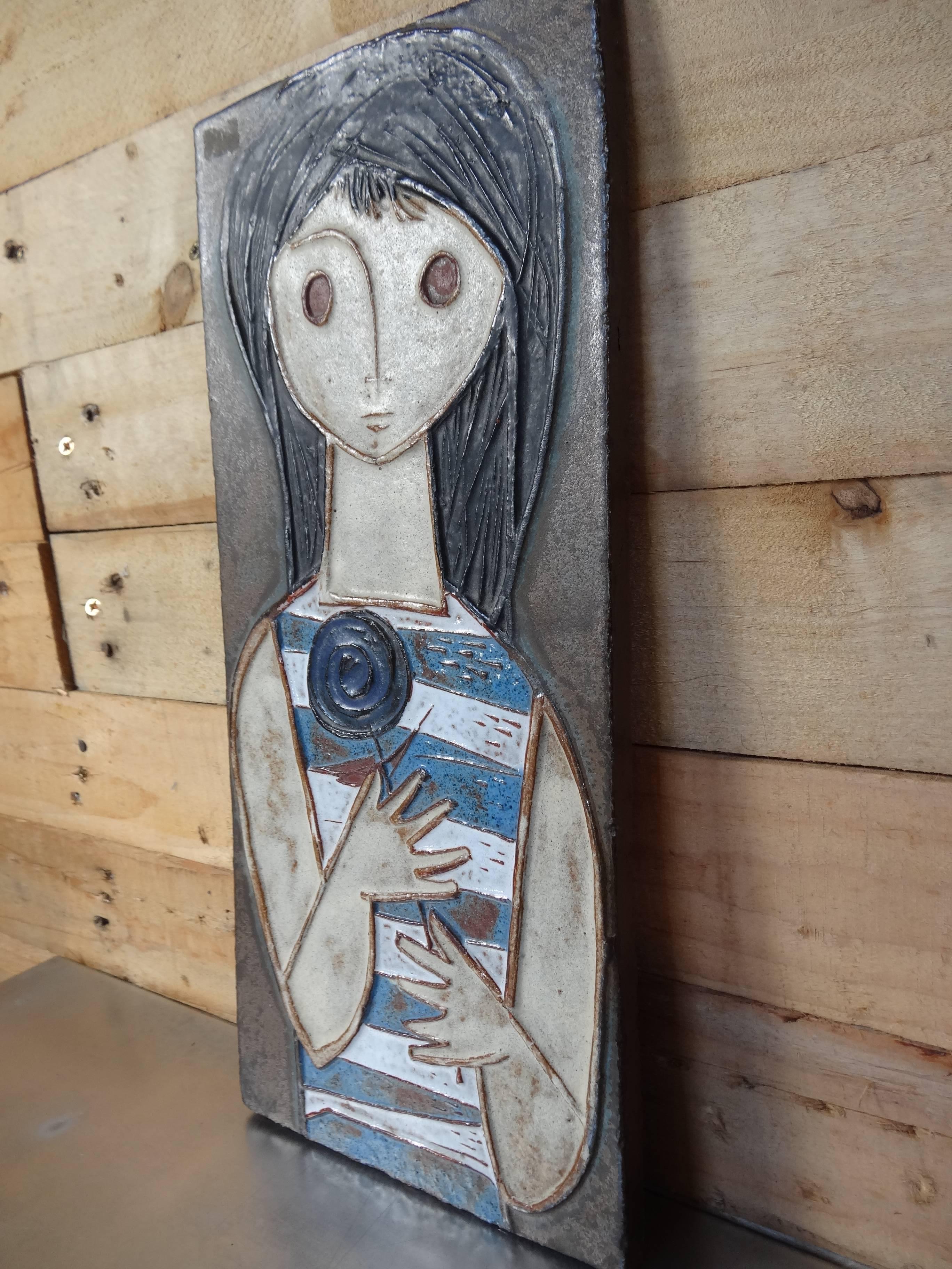 20th century Amphora wall plaque of a girl with flower, we currently have four of the Amphora plaques available.