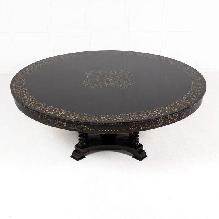 Extremely large ebonised and ivory inlaid centre table.
With a quadripartite platform base and five turned columns supporting the top, one central column, and four smaller columns to the corners of the platform.
All the columns were beautifully