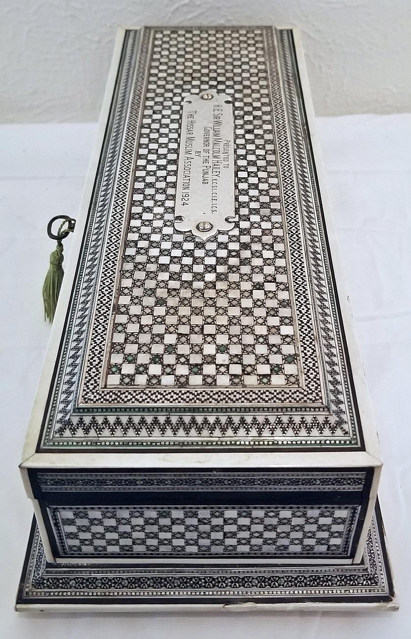 Presenting a highly important and exceptional Anglo-Indian document or scroll box from the 1920s.
1924 to be exact!!
Made in Punjab, in the style of Bombay Sadeli Mosaic.
It bears a solid silver plaque on the lid with the following