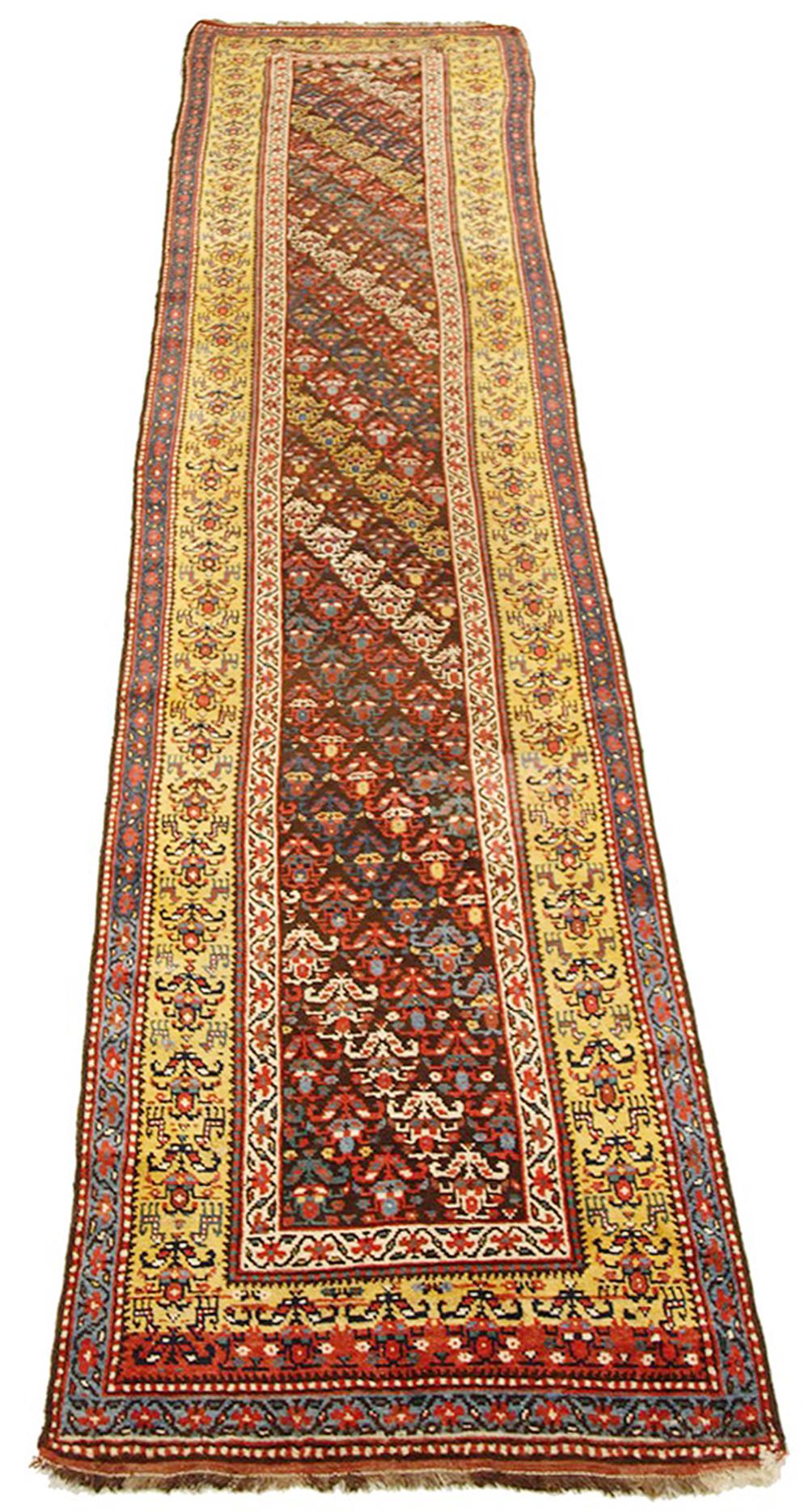 Antique Azerbaijan runner rug handwoven from the finest sheep’s wool and colored with all-natural vegetable dyes that are safe for humans and pets. It’s a traditional Azerbaijani design featuring mixed floral and geometric details over a deep yellow
