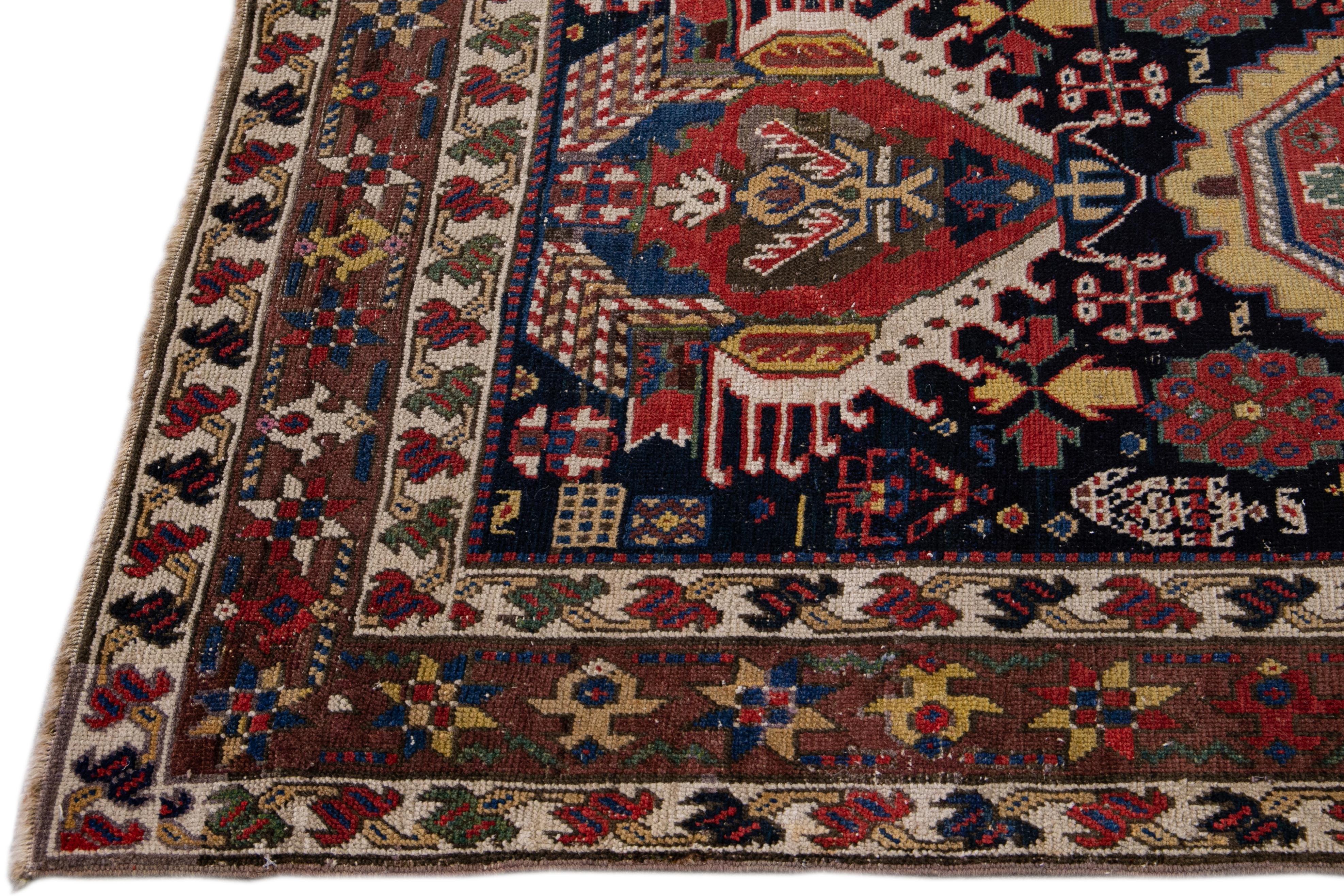 Hand-Knotted 20th Century Antique Caucasian  Kazak Multicolor Designed Blue Wool Runner For Sale