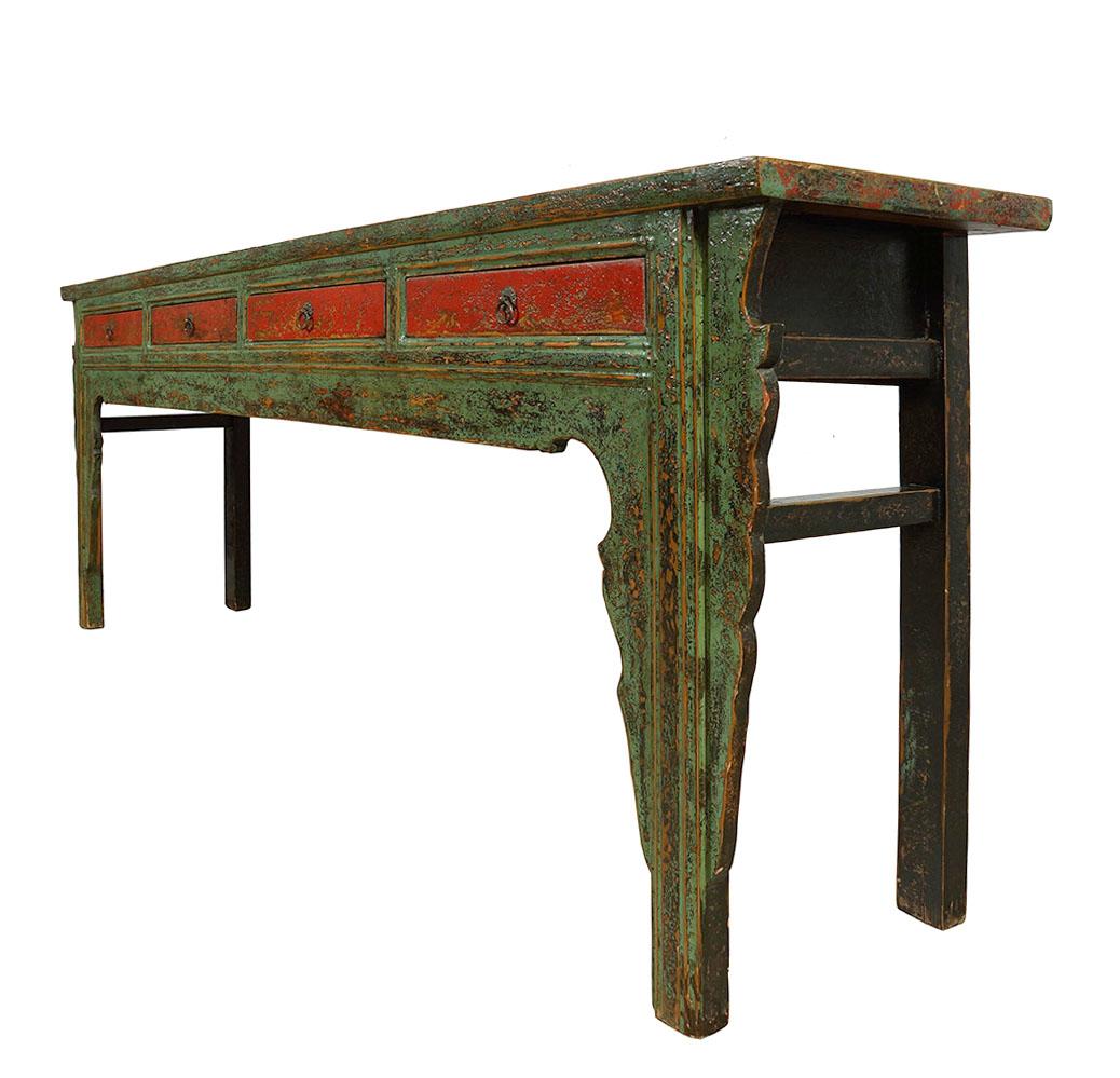 This antique Chinese long sofa table has about 100 years history with green and red lacquered finish. It is made from solid wood with beautiful antique hardware on the drawers front. It featured beautiful carving works around the legs and bottom,