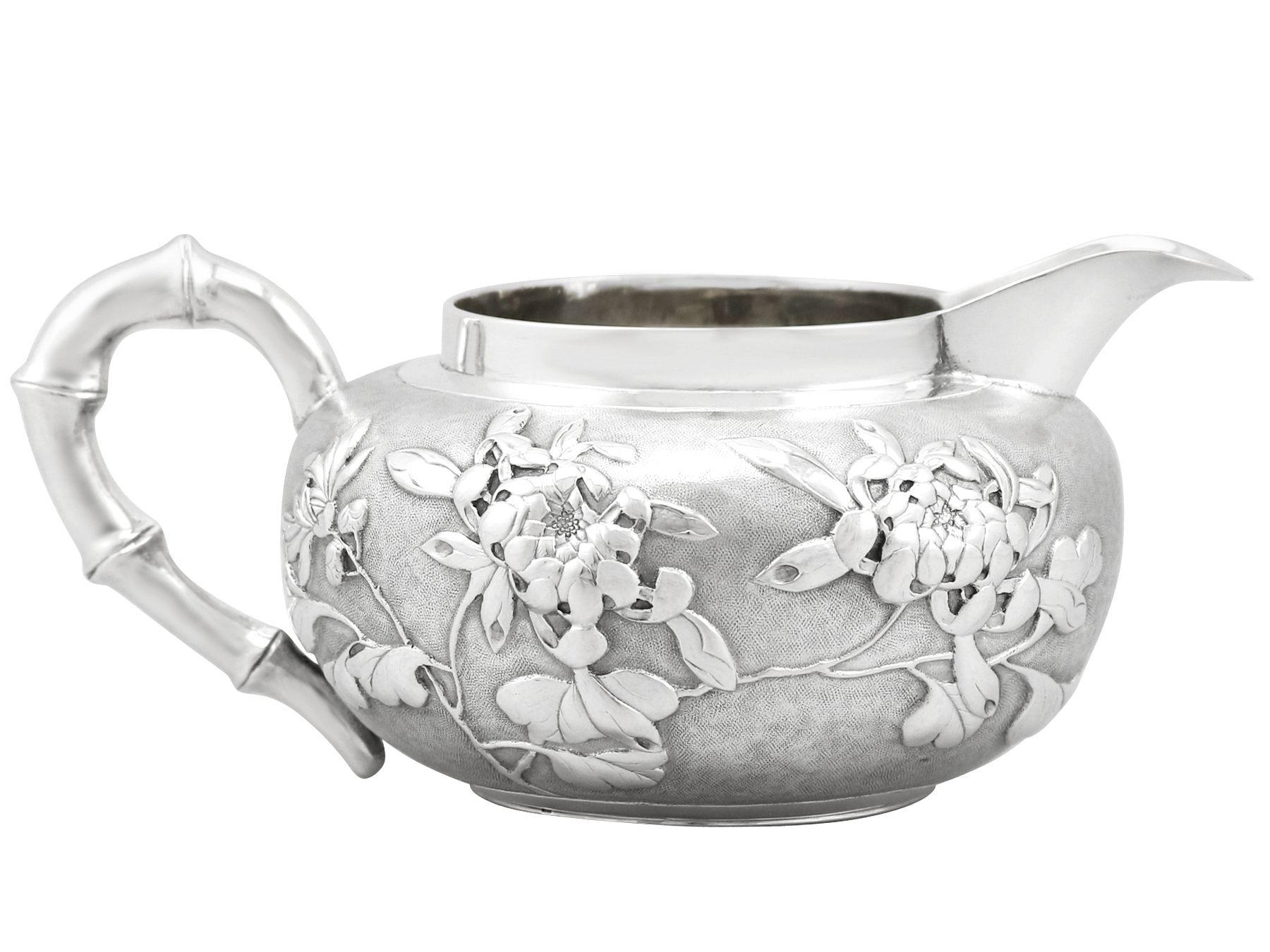 A fine and impressive antique Chinese export silver cream jug, an addition to our Asian silver teaware collection

This impressive antique Chinese export silver cream jug has a circular rounded form.

The surface of this antique cream jug is