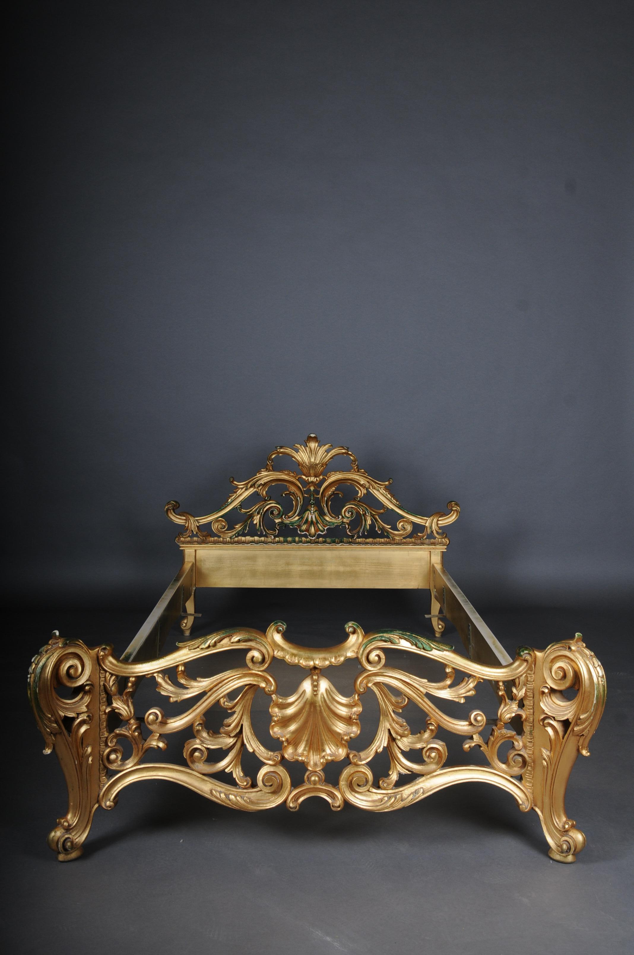 20th century antique French Louis XV bed, gold, Rococo

Impressive antique Louis XV single bed.
Wooden body, with rich and delicate hand-carved ornaments in the classic Louis XV style.

Curved and ornate body, gilded and patented.