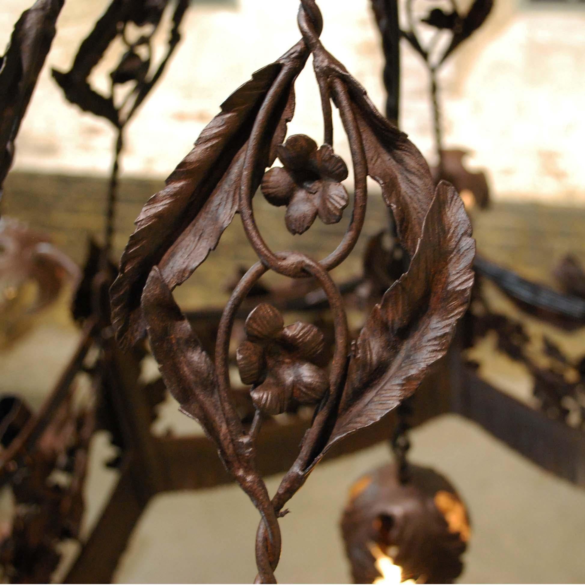 Hammered 20th Century Antique French Wrought Iron Chandelier with Leafs and Flowers For Sale