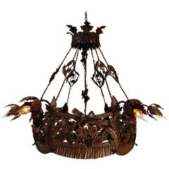 Lustre français ancien en fer forgé du XXe siècle avec feuilles et fleurs