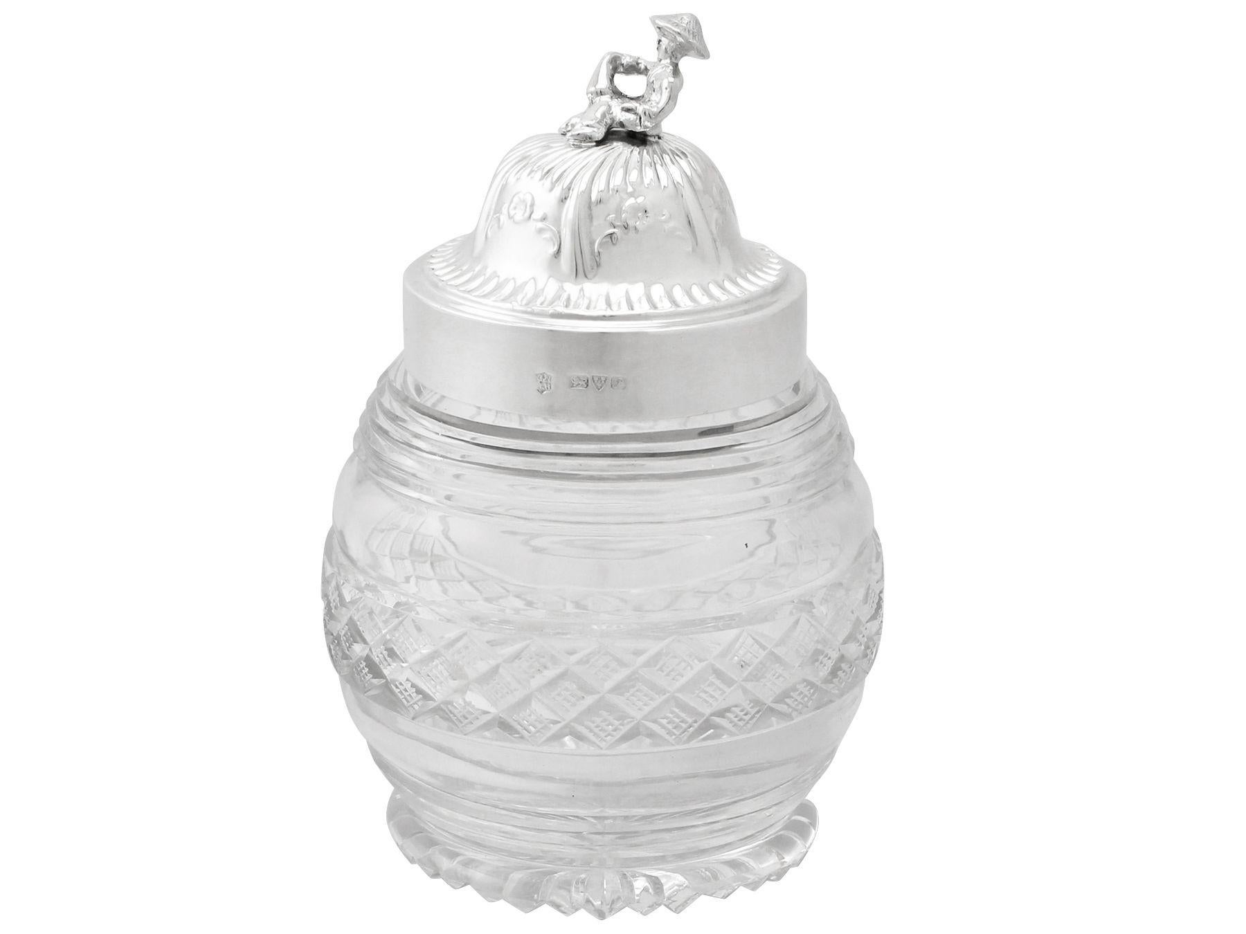 A fine and impressive antique George V English sterling silver and cut-glass tea caddy, an addition to our silver mounted glass collection.

This impressive antique George V cut-glass tea caddy has a circular rounded form.

The vessel of this