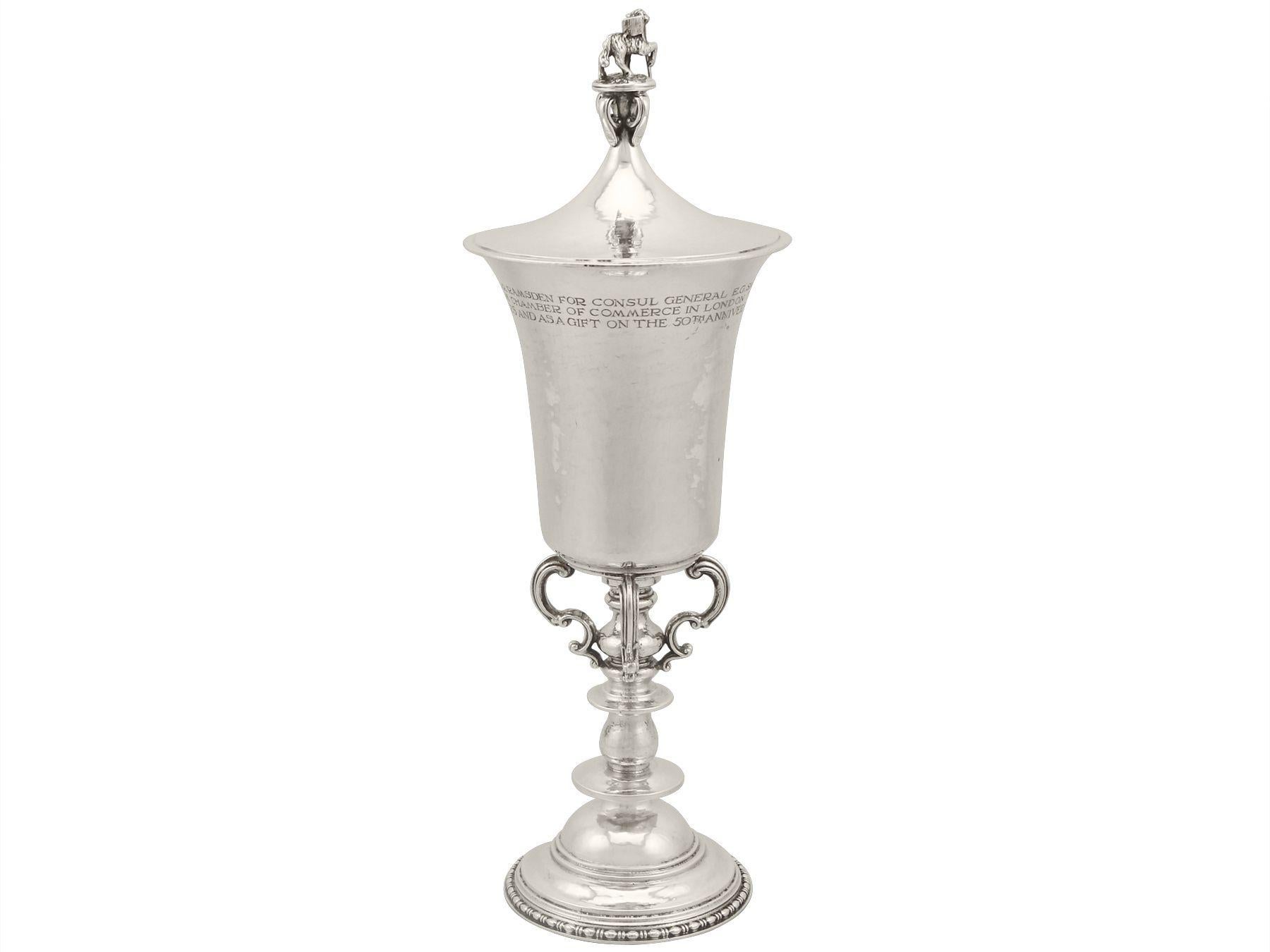 An exceptional, fine and impressive antique George V English sterling silver cup and cover made by Omar Ramsden; an addition to our diverse presentation silverware collection

This exceptional, fine and impressive antique silver cup and cover has