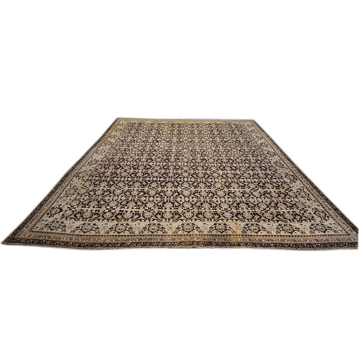 Ashly Fine Rugs presents a 1900 Antique Indian Agra 11.9x14.4 Brown, Ivory, Yellow, & Light Purple Handmade Area Rug. Indian Agra rugs are very similar to Persian rugs, but vary as they have more earthy colors and smaller patterns than your normal