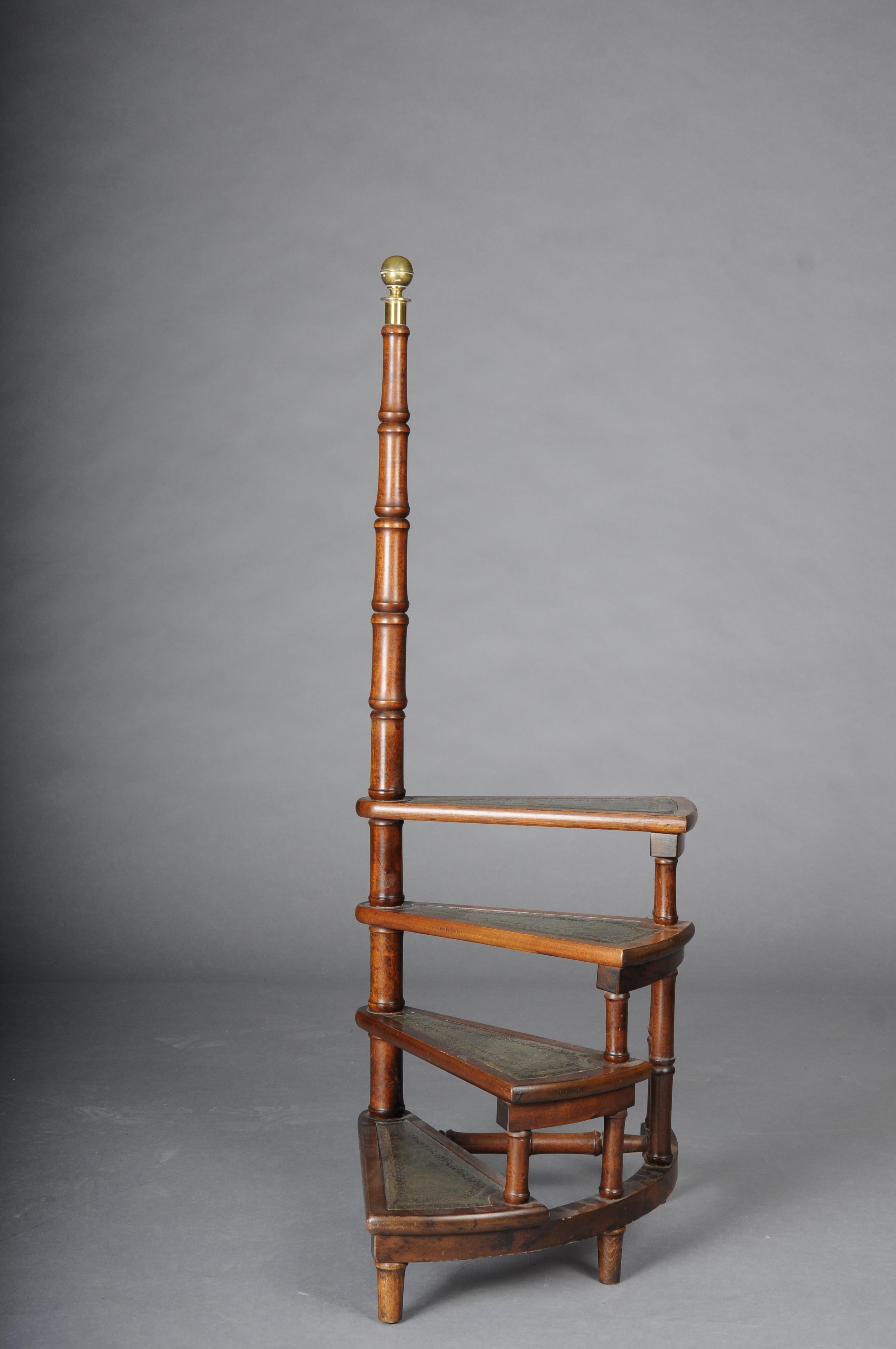 20th Century Antique library ladder/step ladder, mahogany England.

Solid wood covered with green leather. four-stage with a long turned handle. Very stable and robust. Rare body shape. England 20th century.