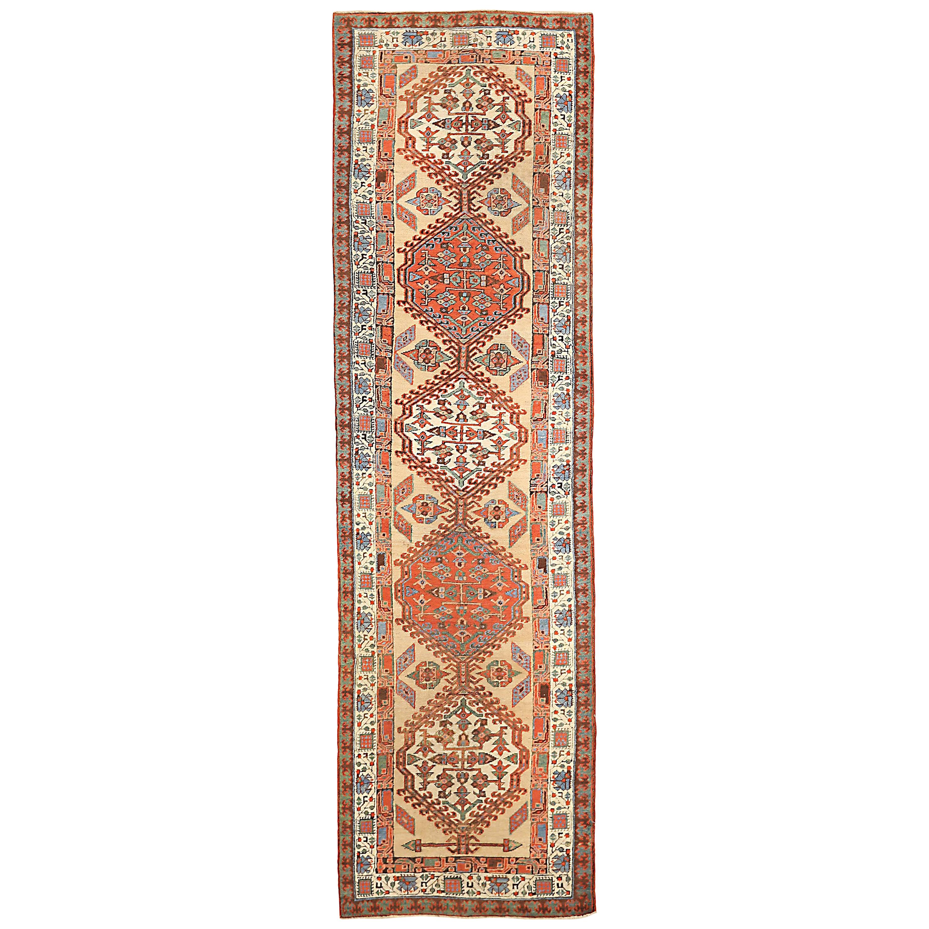 20th Century Antique Persian Azerbaijan Runner Rug with Red and Ivory Medallions For Sale