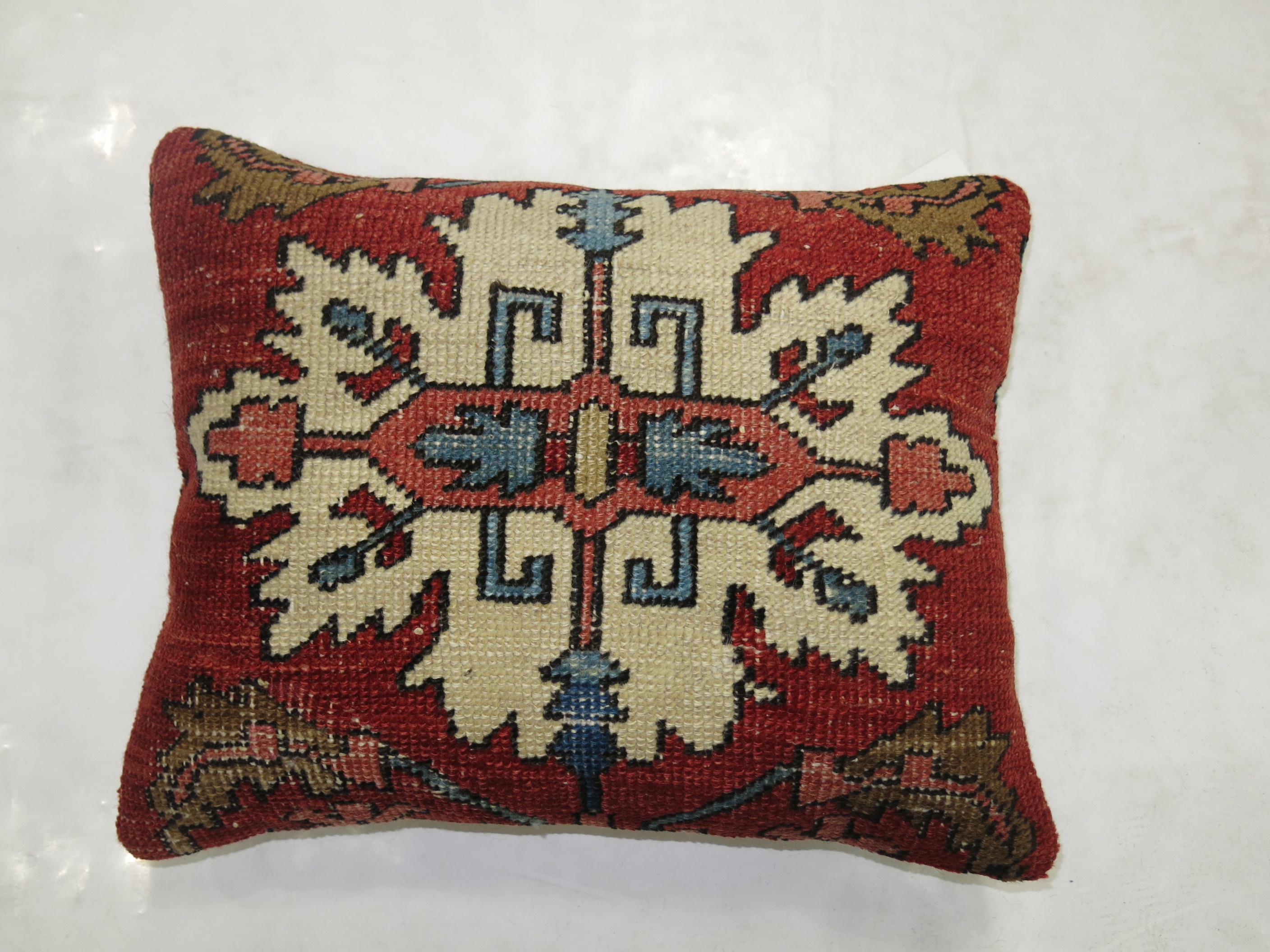 Pillow made from a fine quality Persian Serapi rug. Ivory Medallion with red brick , blue and brown accents

Measures: 15